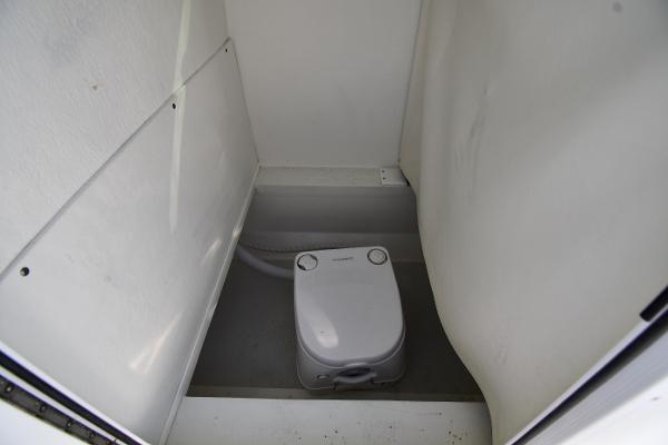 2021 Eastern 248 Center Console boat interior with portable toilet.