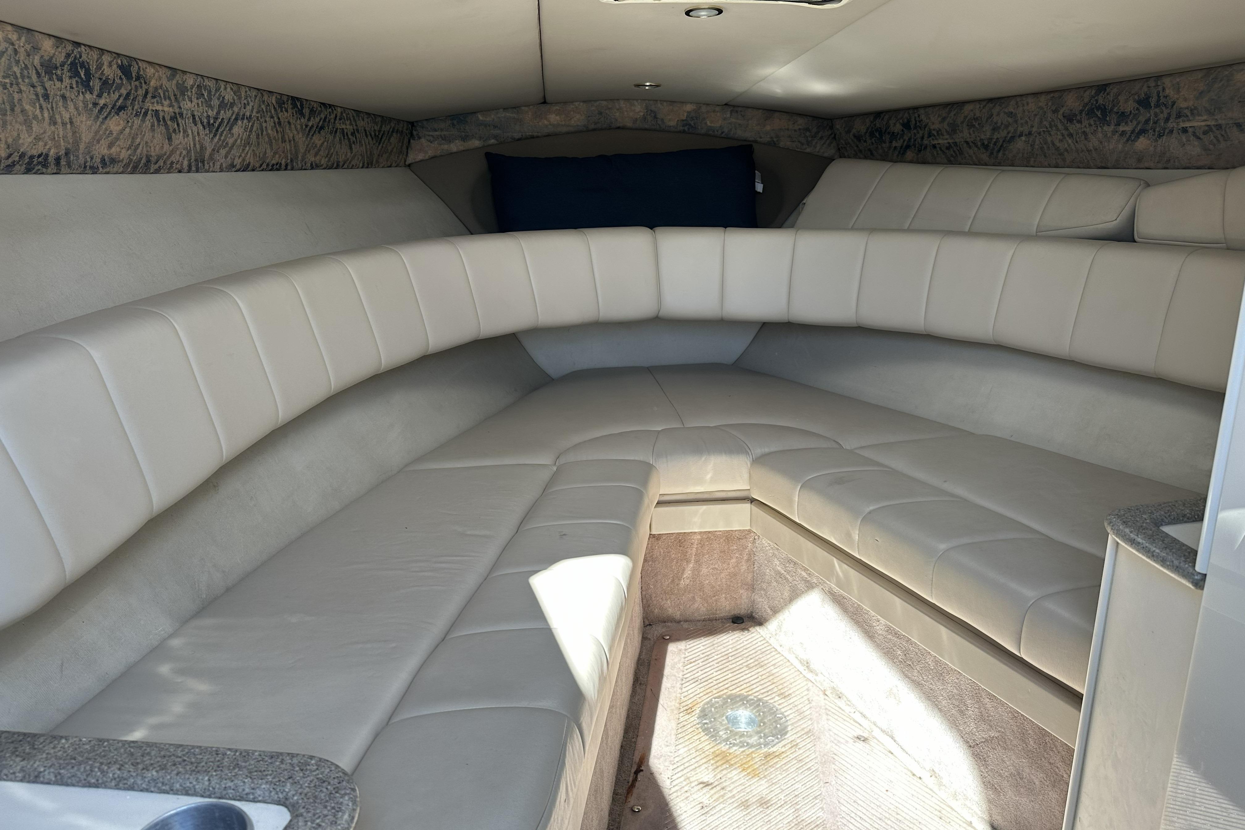 Interior of a 2000 Formula 280 Sun Sport boat with beige seating.