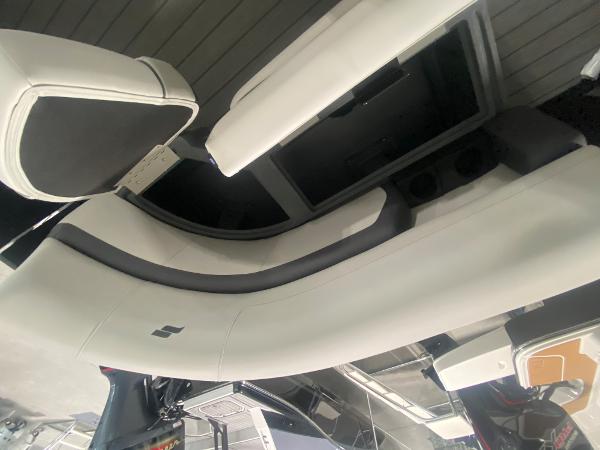 2024 Starcraft EXS 1 boat interior seating with white and black upholstery.