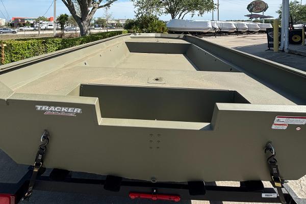 2025 Tracker GRIZZLY 2072 Utility boat, olive green, parked outdoors.