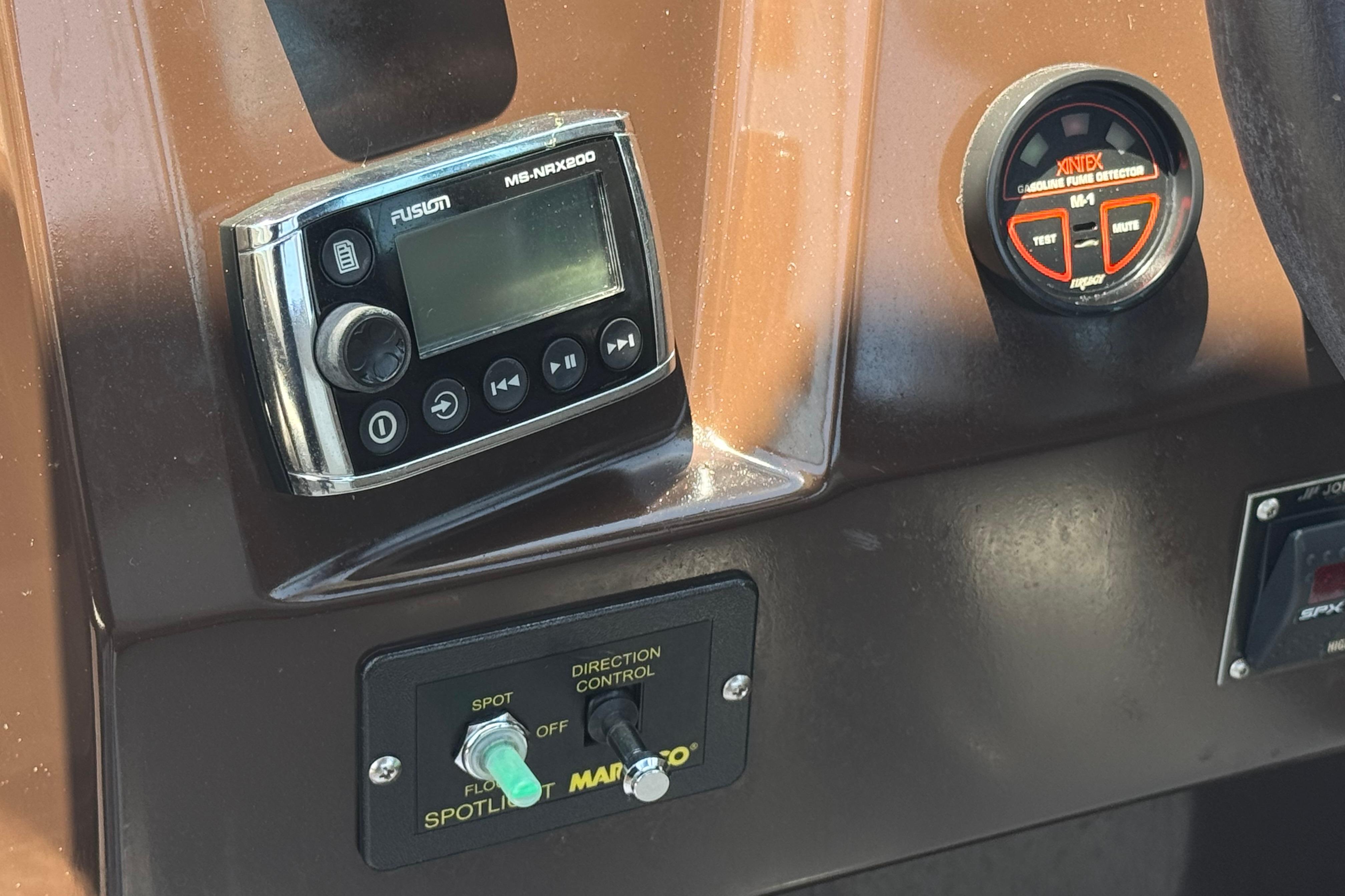 Control panel of a 2013 Regal 28 Express boat with audio and safety features.