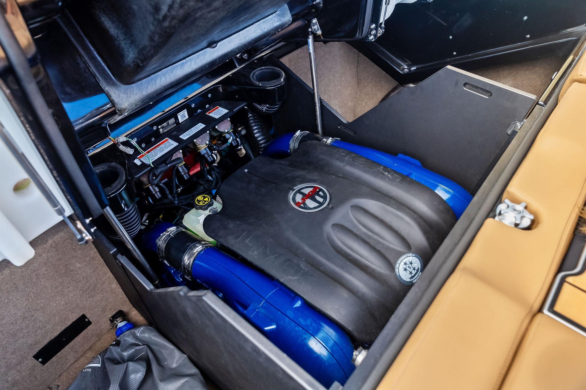 2024 MasterCraft X24 engine compartment with detailed components and blue accents.