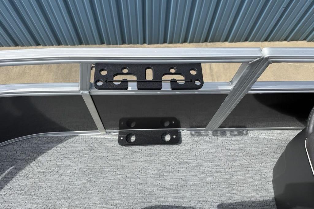 2026 Sun Tracker Bass Buggy 16 XL Select boat interior with metal railing and mounting bracket.