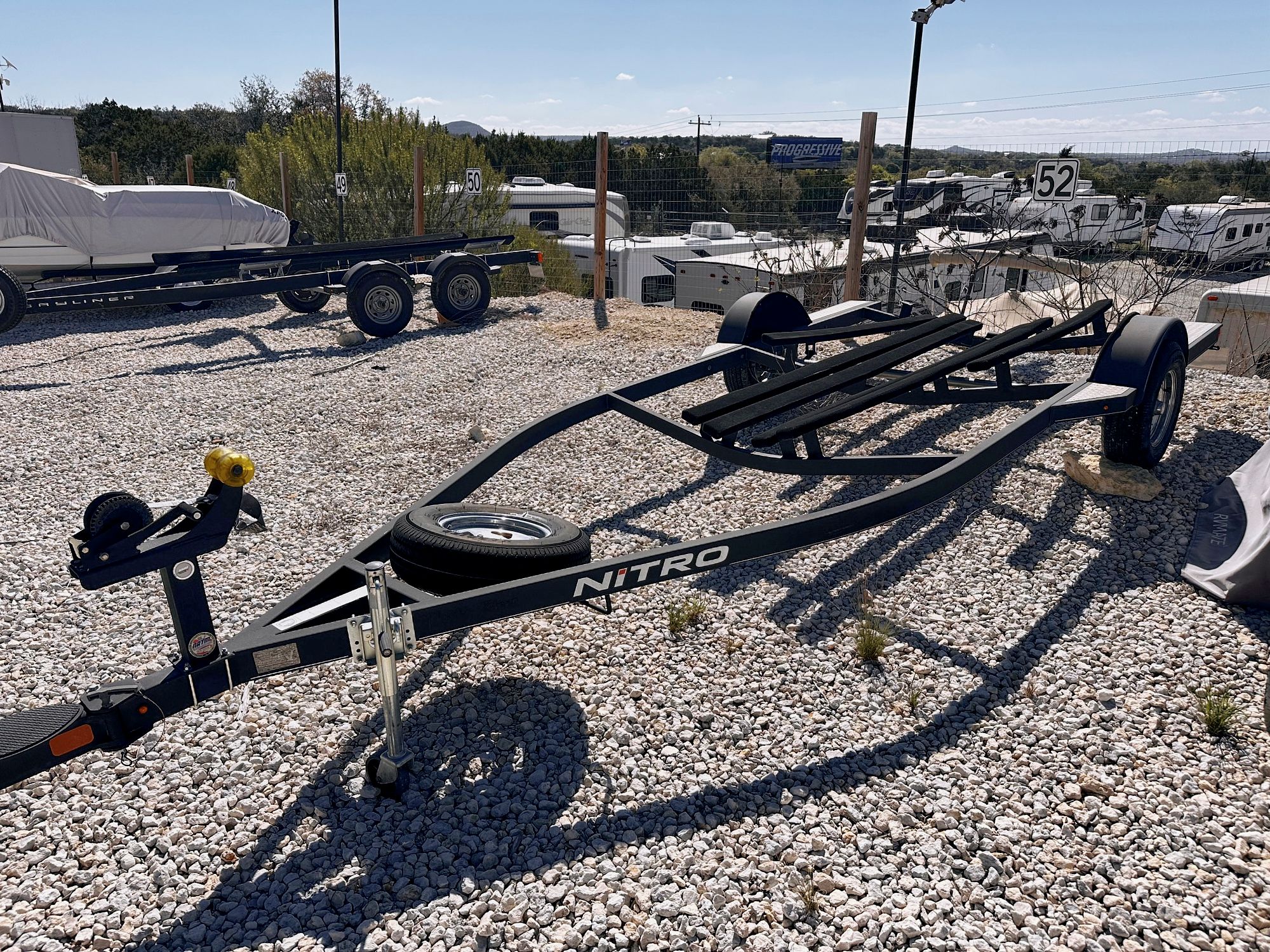2020 Nitro Z19 Sport boat trailer on gravel lot.