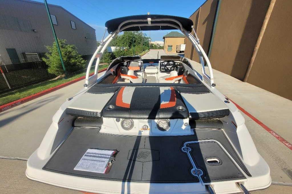 2016 Four Winns H200RS boat with sleek design, parked outdoors.