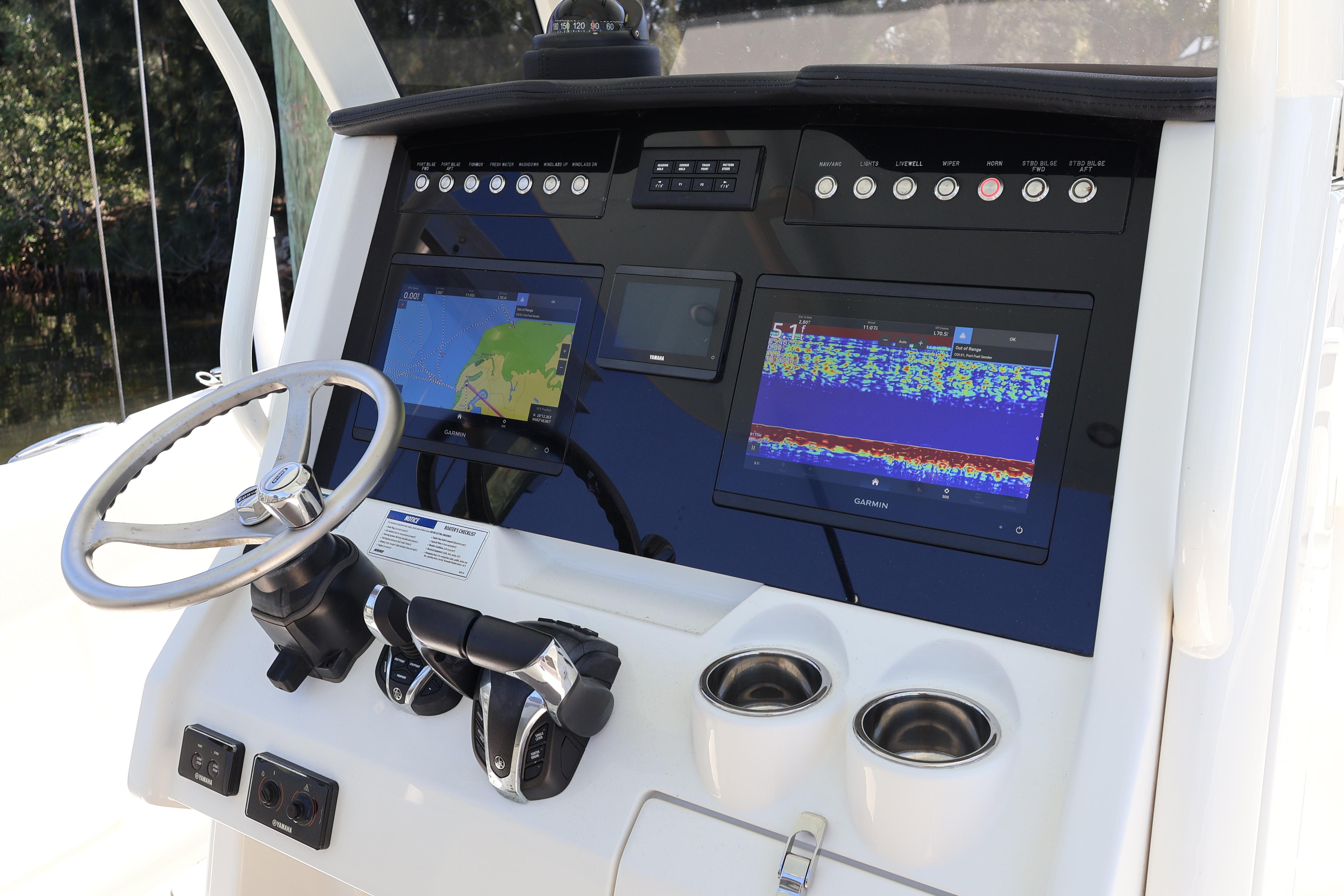 2022 World Cat 280 CC-X dashboard with Garmin navigation and control systems.