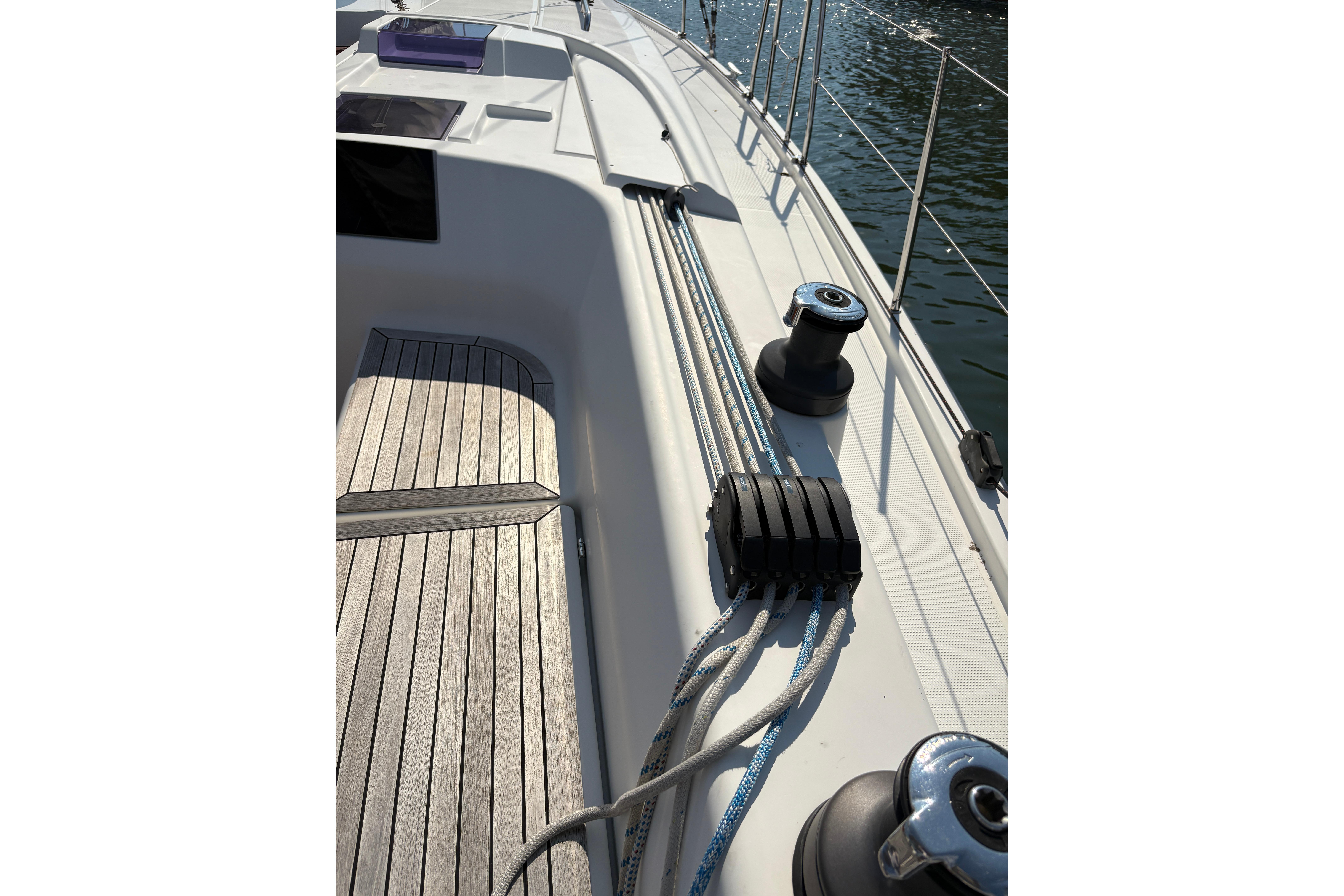 Deck view of a 2014 Hanse 415 sailboat with winches and ropes.
