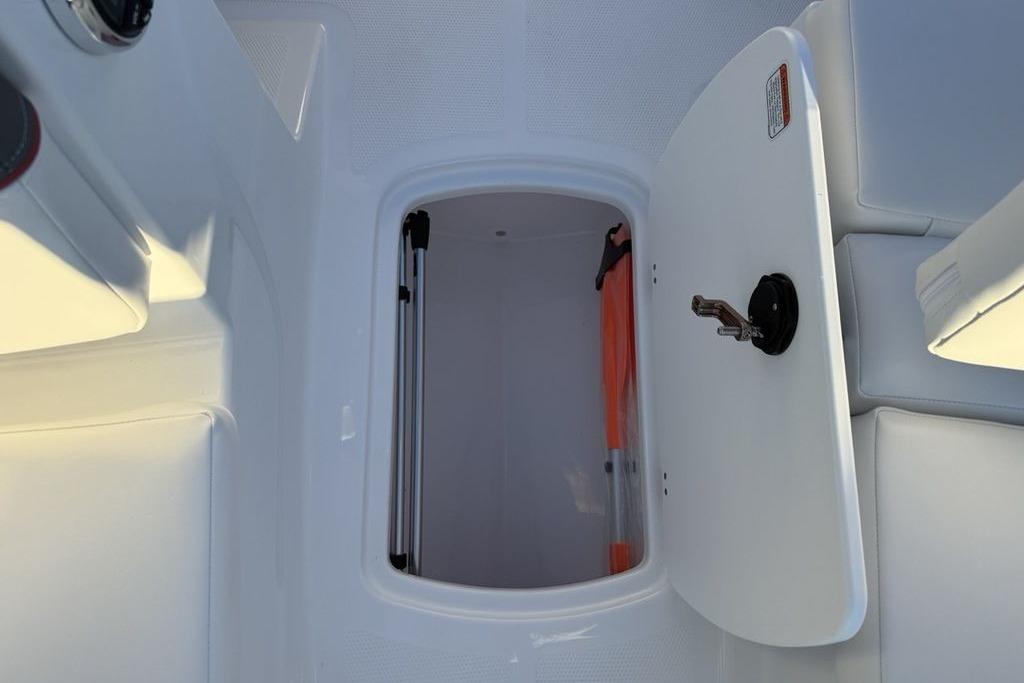 2026 Tahoe T16 boat storage compartment with open hatch and visible interior.