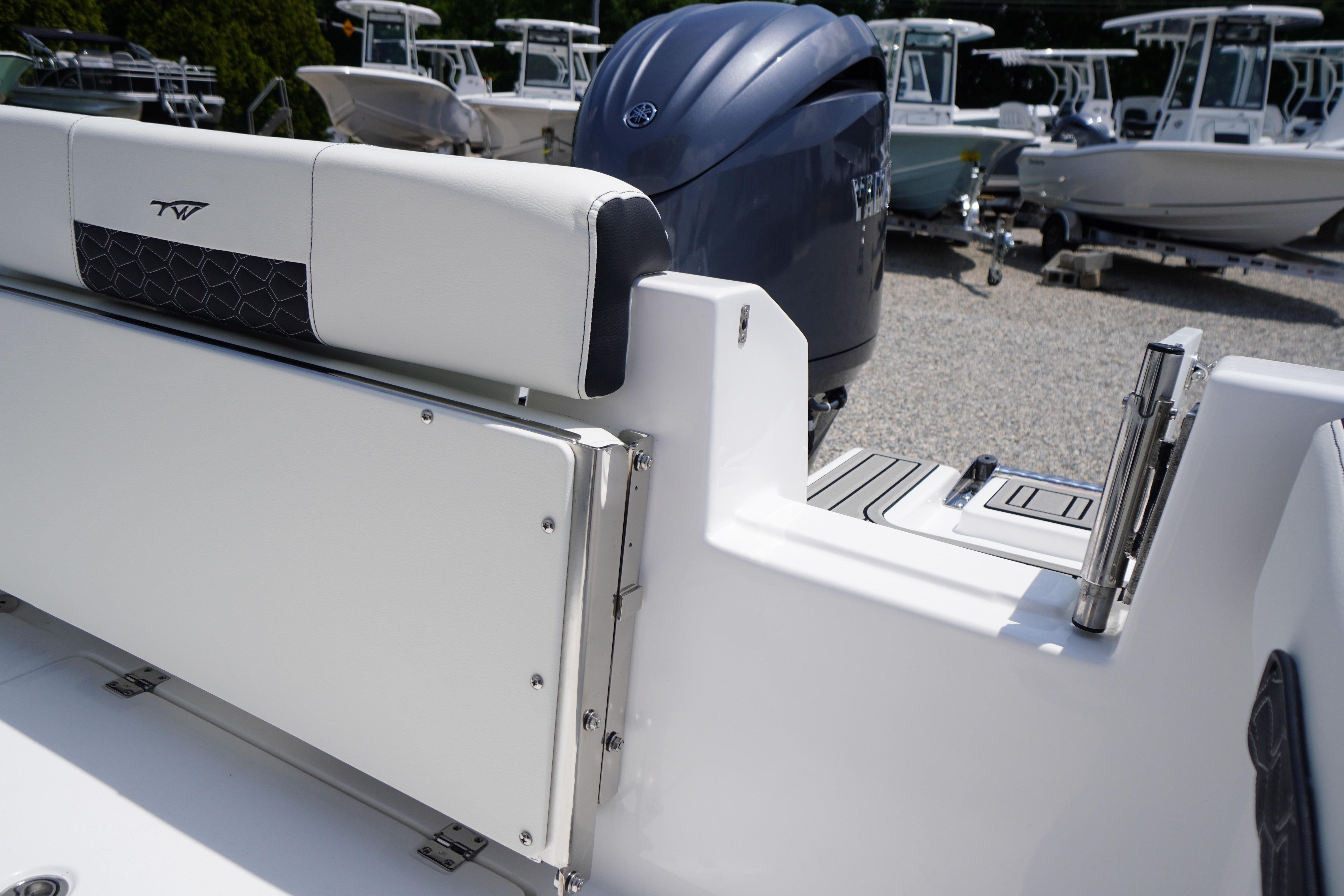 2027 Tidewater 220 CC Adventure boat with sleek seating and powerful outboard motor.