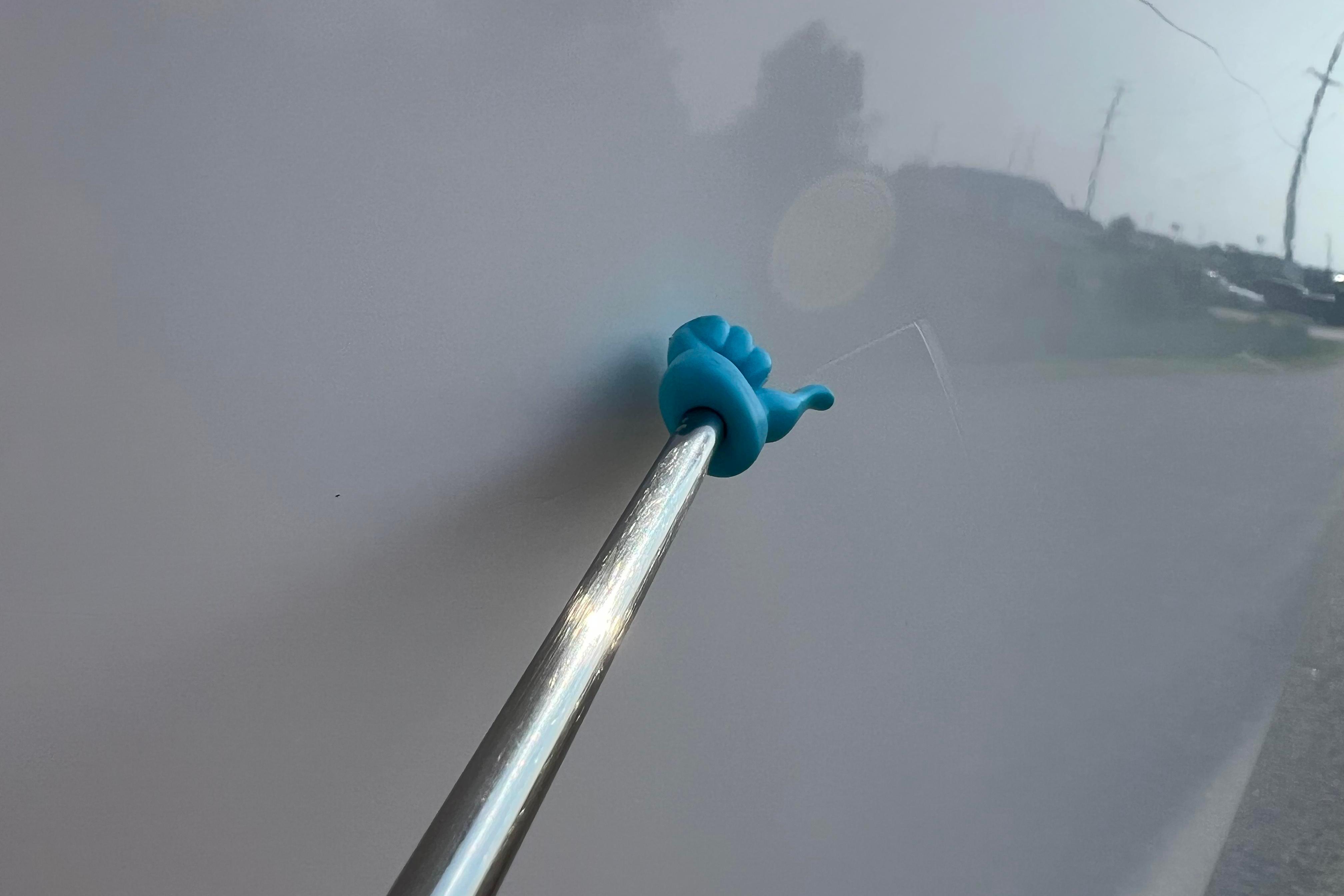 Blue suction cup tool on a 2012 Sea Fox 206 Center Console boat surface.
