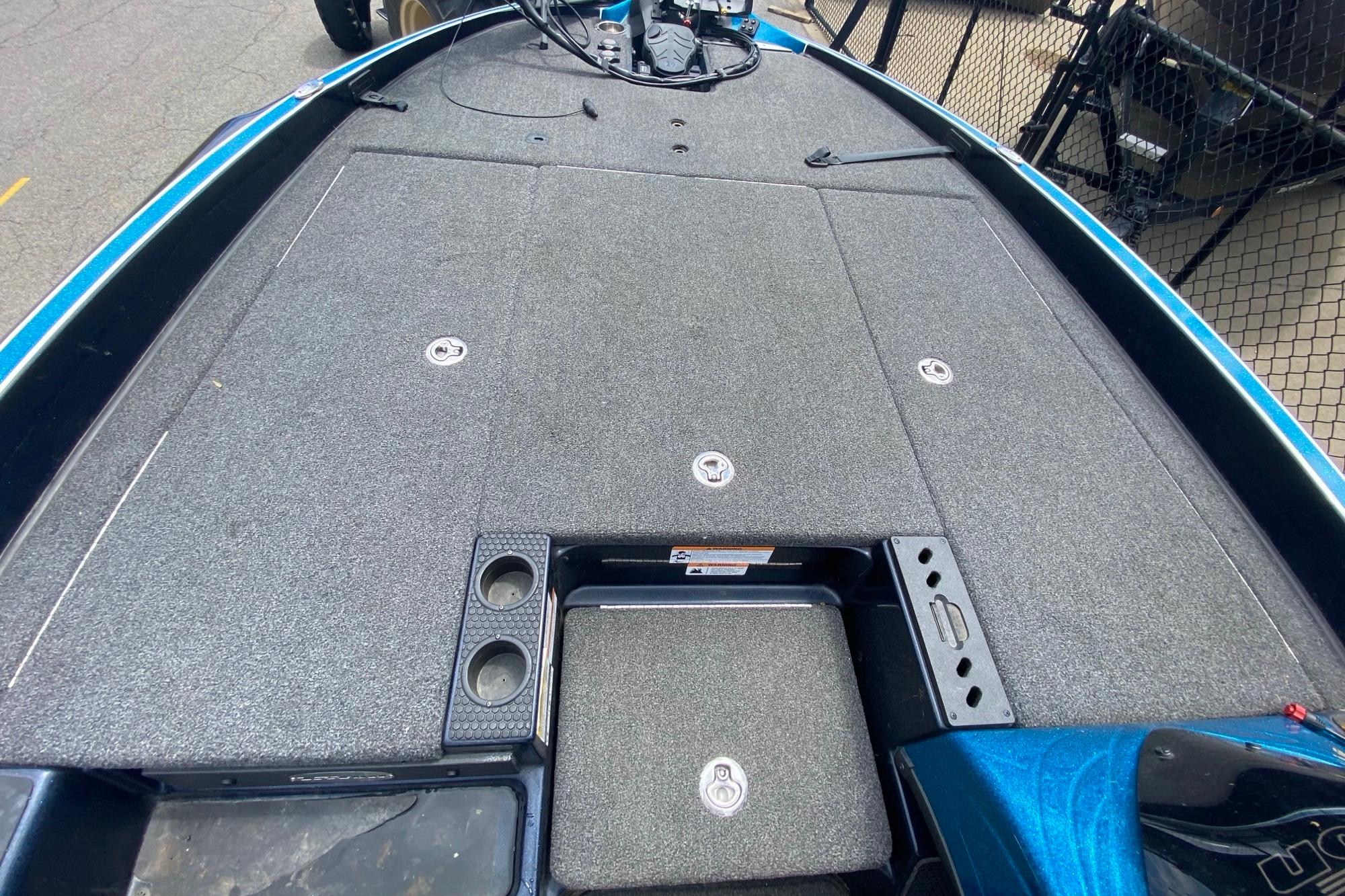 2020 Triton 20 TrX Patriot boat deck with storage compartments and cup holders.