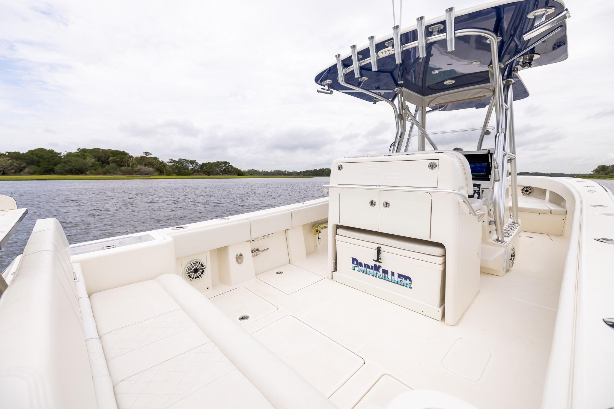 2019 SeaVee 322Z boat interior with seating and console, on a calm waterway.