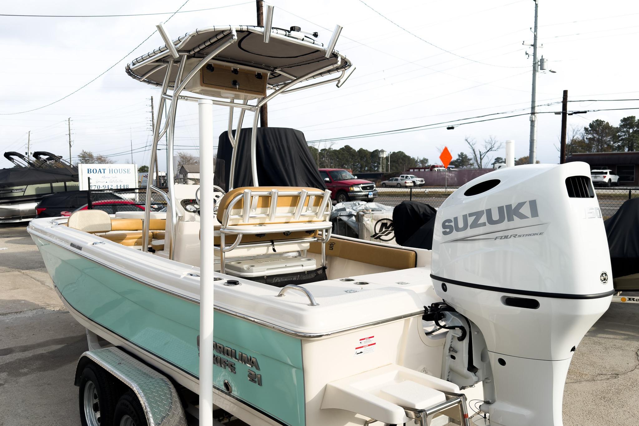 2025 Carolina Skiff 21 Ultra Elite boat with Suzuki outboard motor on trailer.