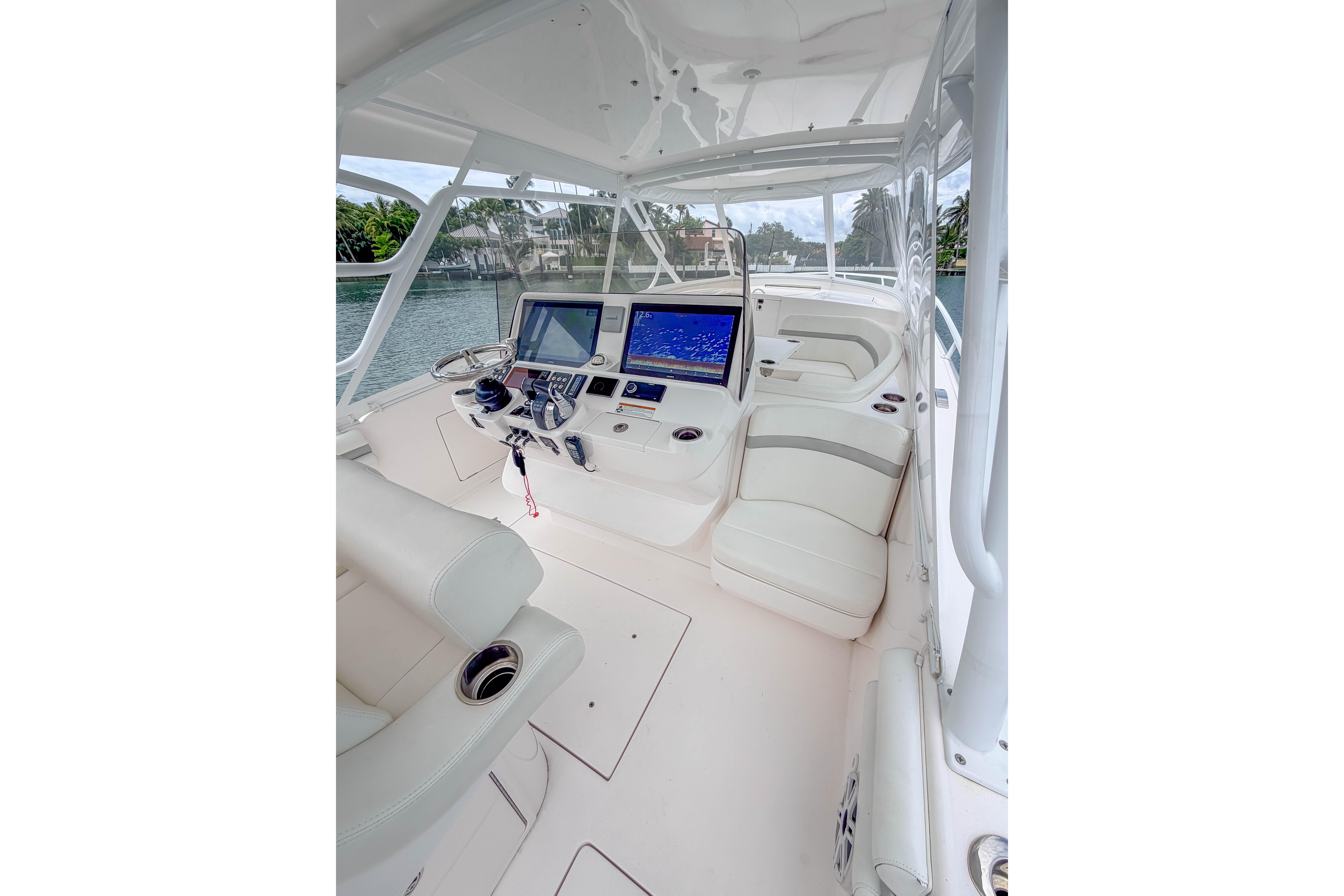 2021 Intrepid 409 Valor boat interior with modern navigation equipment and luxurious seating.