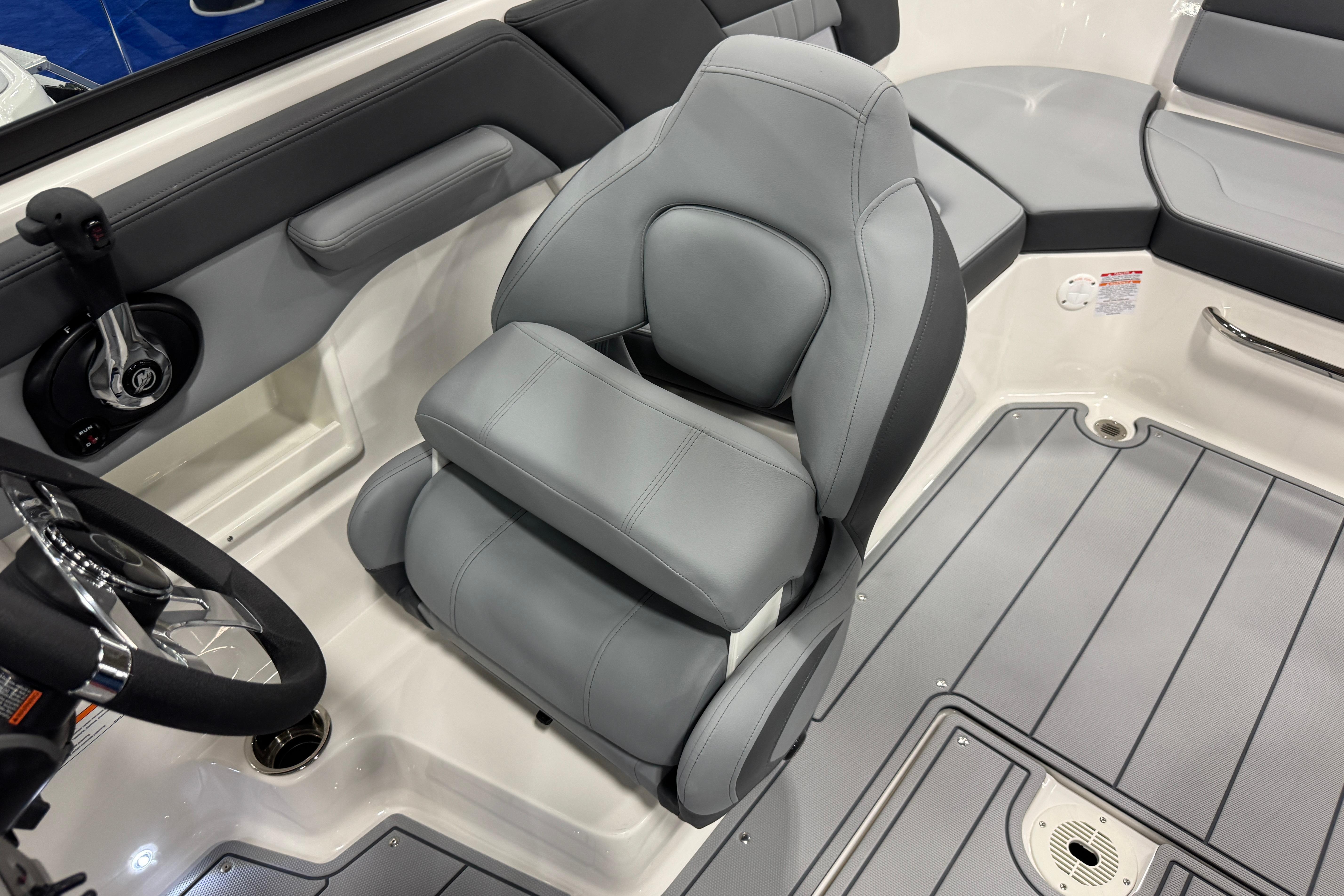 2026 Chaparral 23 SSi boat interior with gray seating and steering wheel.
