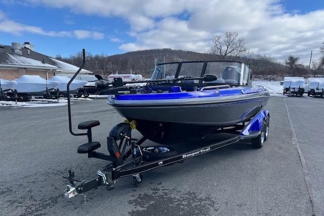2026 Ranger 1880MS boat on trailer, parked outdoors under cloudy sky.