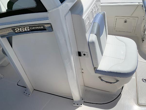 2024 Robalo 266 Cayman boat interior with seating and storage.