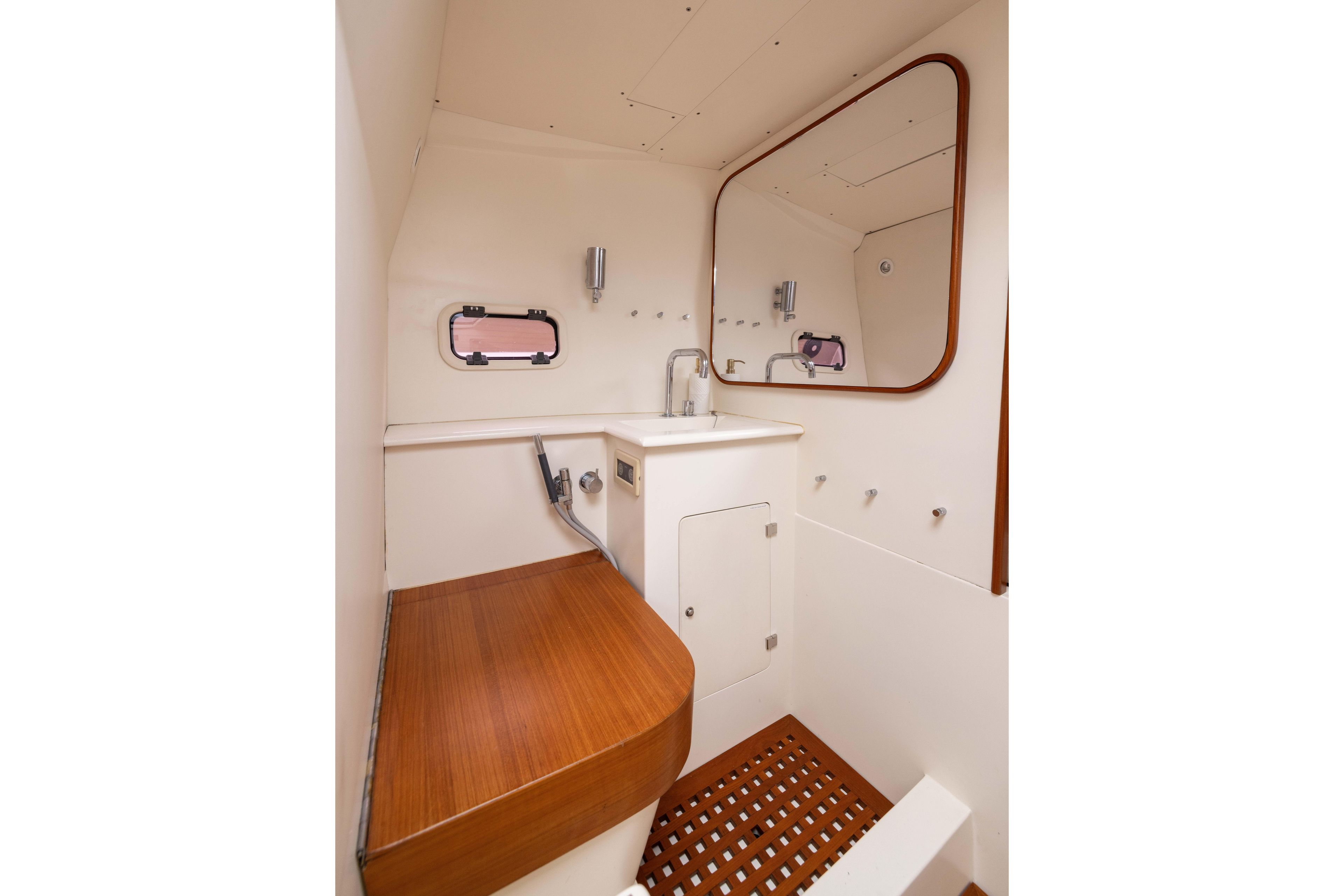 Interior of 2005 Wally Yachts Tender Express bathroom with wooden accents and mirror.