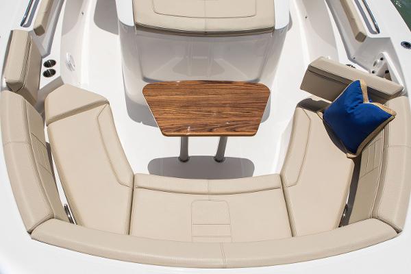 Manufacturer Provided Image: 2018 Pursuit S 368 Sport boat with beige seating and wooden table.