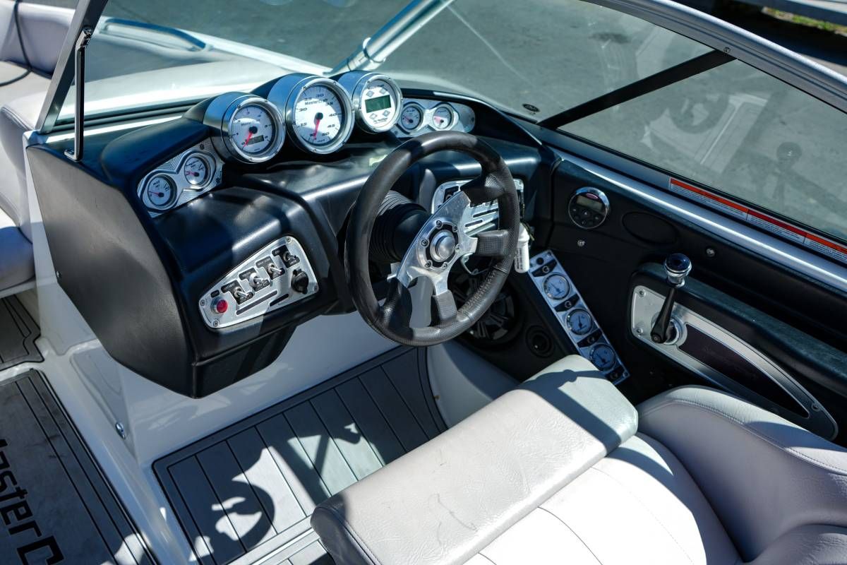 The image shows the cockpit of a 2007 MasterCraft X-45 boat with a modern dashboard.