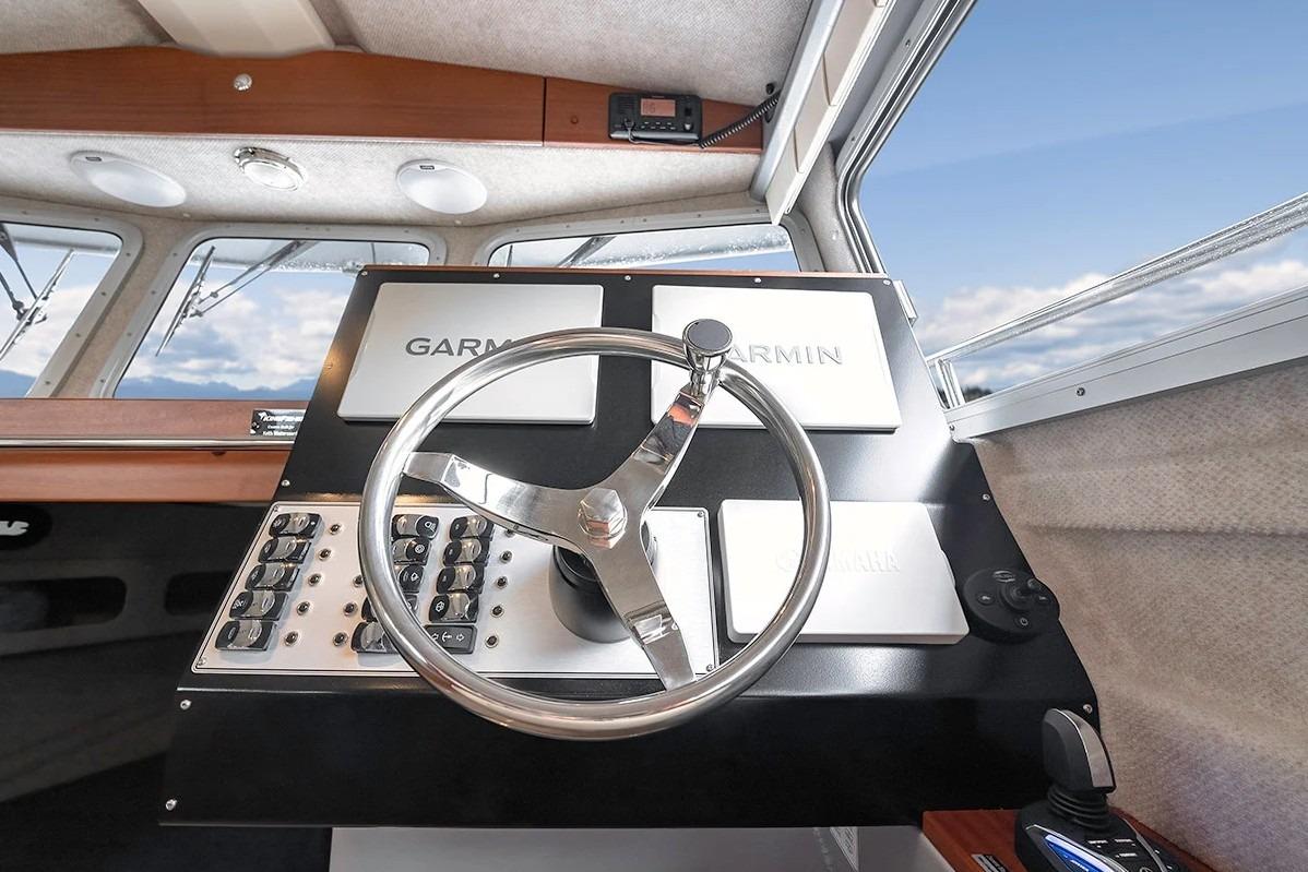 Helm of 2026 KingFisher 3225 GFX Offshore boat with Garmin navigation system.