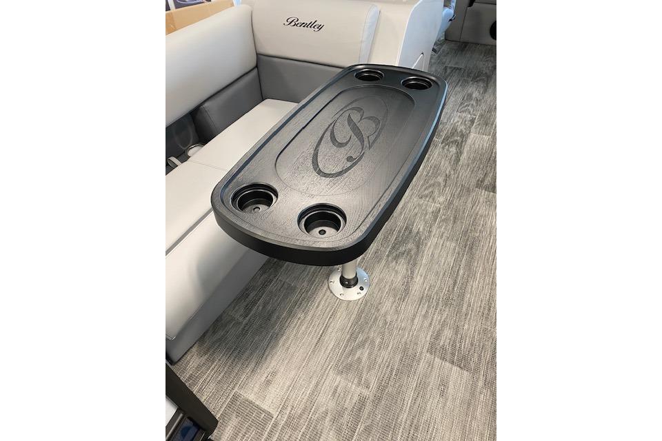 2026 Bentley Pontoons Legacy 243 Swingback interior with table and cup holders.