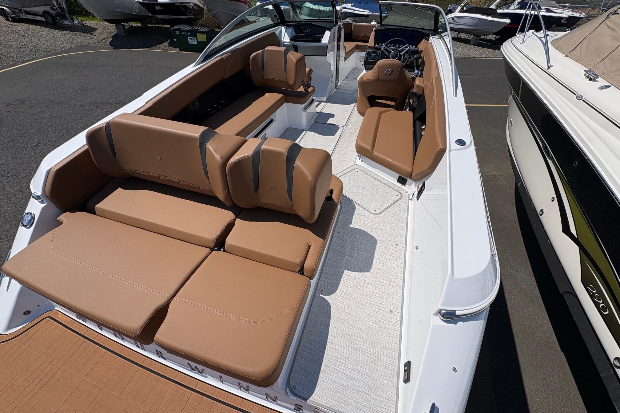 2026 Four Winns H6 boat with spacious tan seating and sleek white interior design.