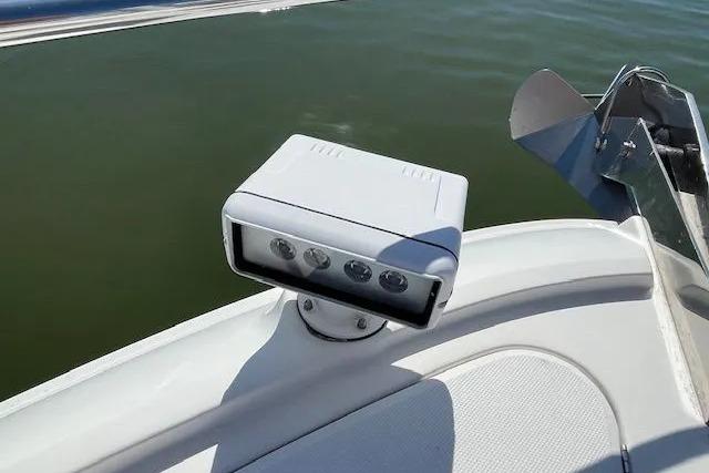 2016 Sea Ray Sundancer 510 spotlight on deck, overlooking calm water.