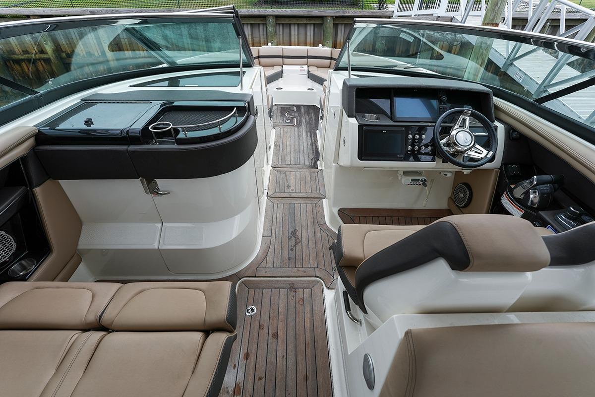 2018 Sea Ray SLX 350 boat interior with luxurious seating and modern dashboard.