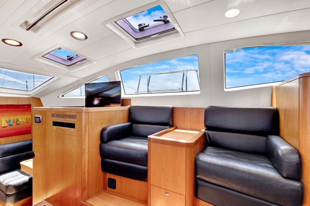 Luxurious interior of 2011 Southerly 57 RS yacht with leather seating and skylights.