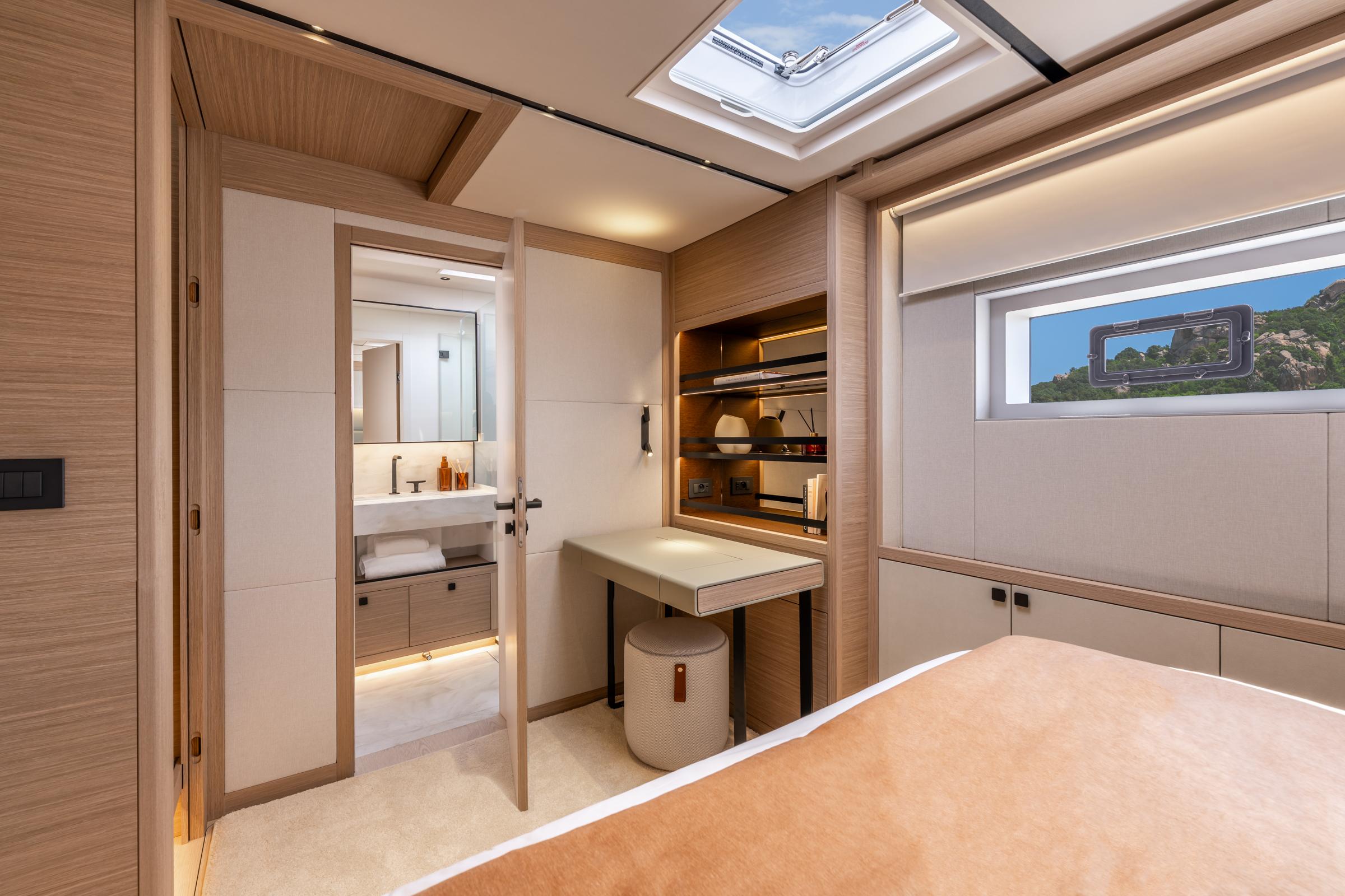 Luxurious interior of 2025 Lagoon Eighty 2 yacht cabin with modern design and natural lighting.