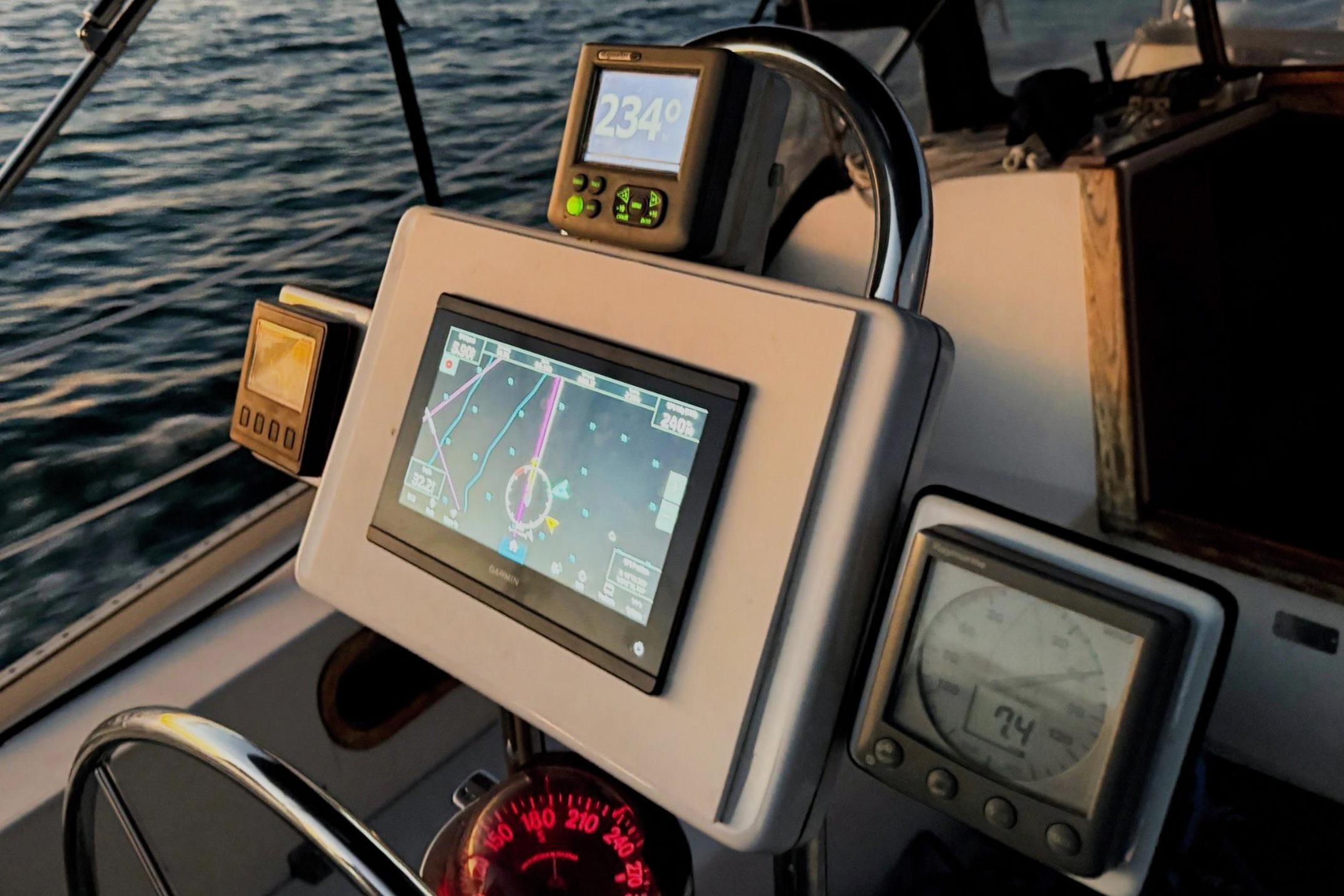 Cockpit navigation instruments on a 1992 Catalina 34 sailboat at sea.