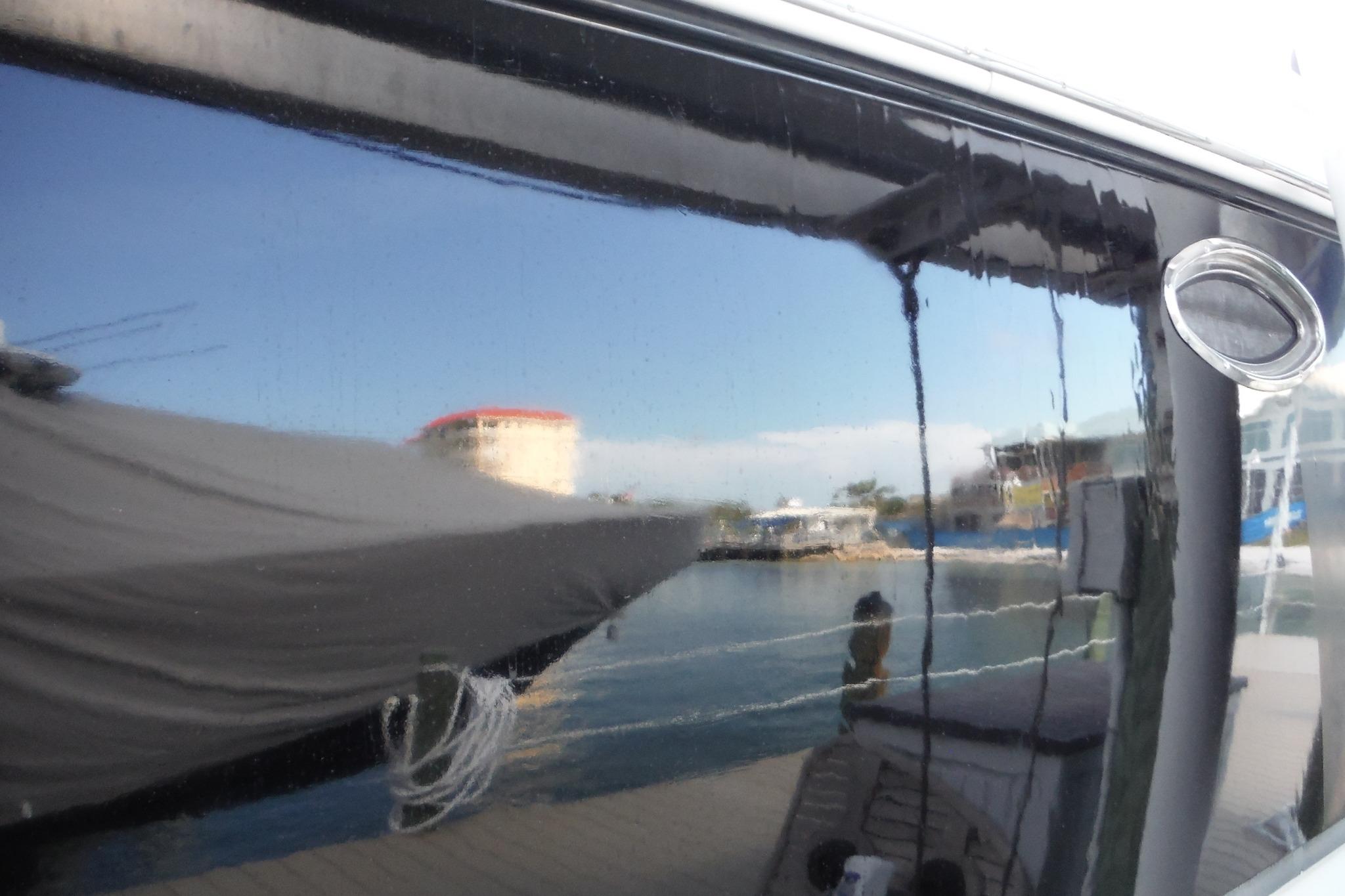 Reflection on Chaparral Signature 350 boat window, marina view, 2005 model.