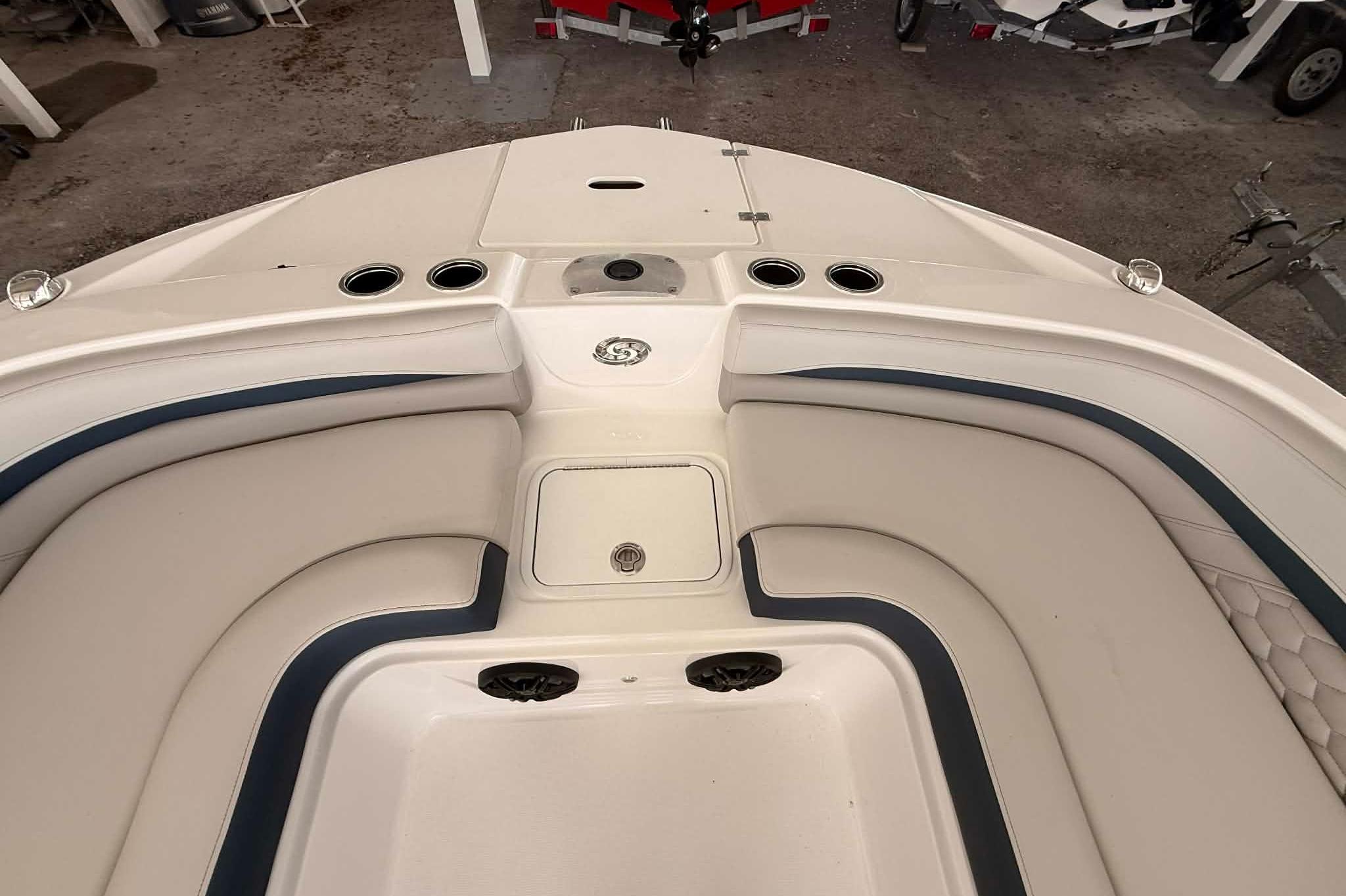 Bow seating area of 2026 Hurricane Sundeck Sport 218 OB boat, featuring cushioned seats.
