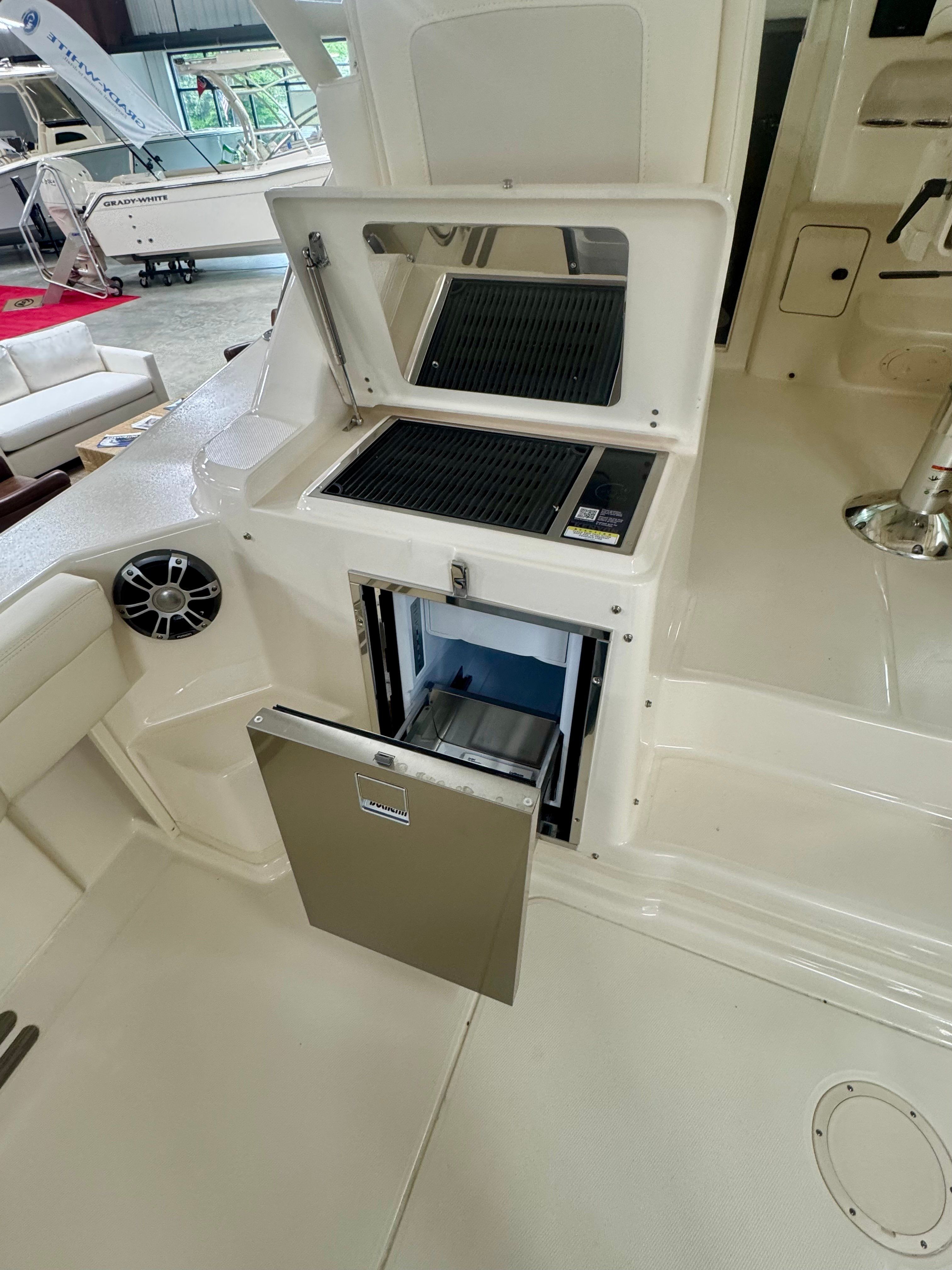 Grady-White Express 330 2025 with built-in grill and refrigerator.