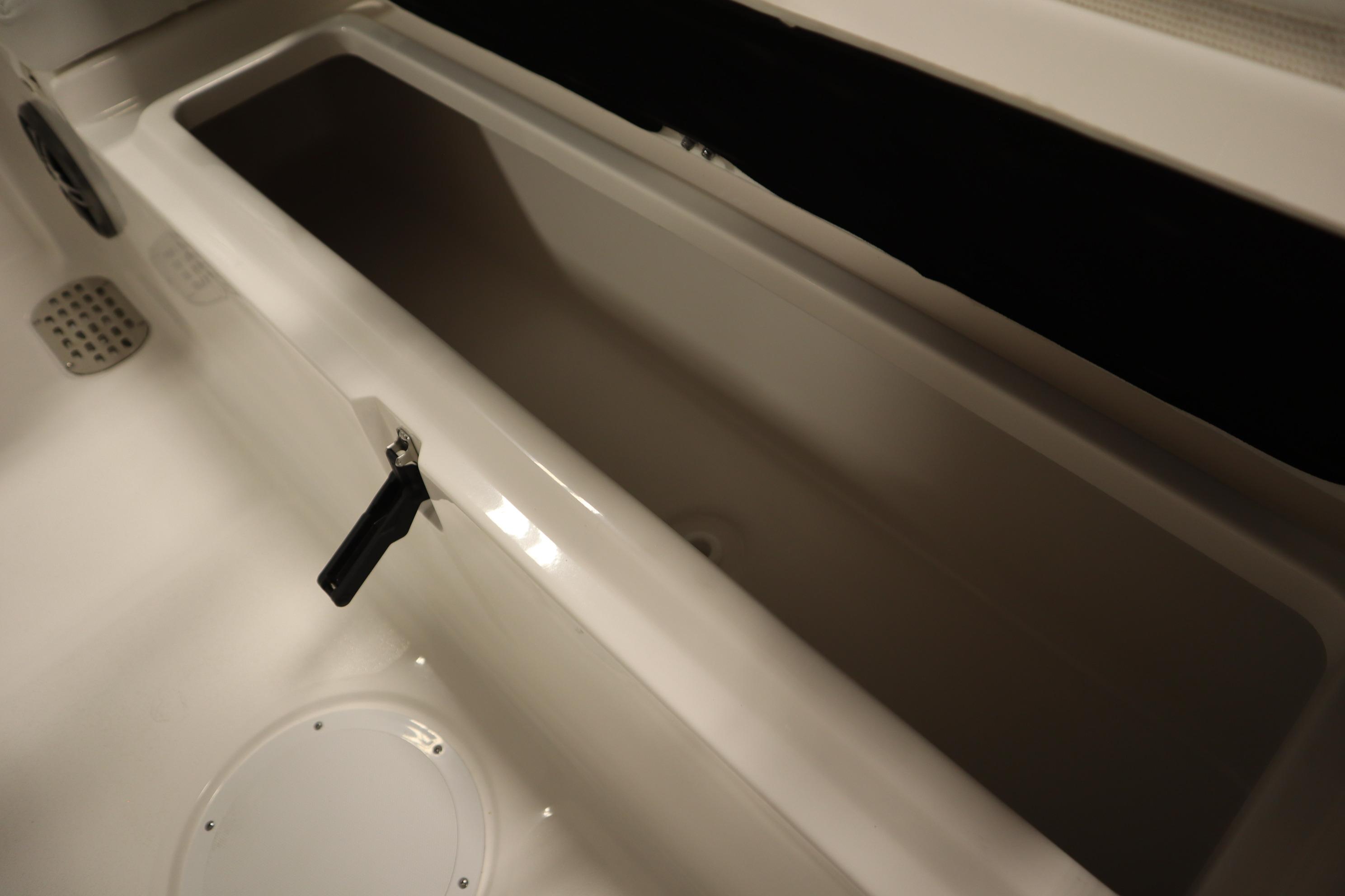 Open storage compartment in 2026 Sea Fox 228 Commander boat interior.