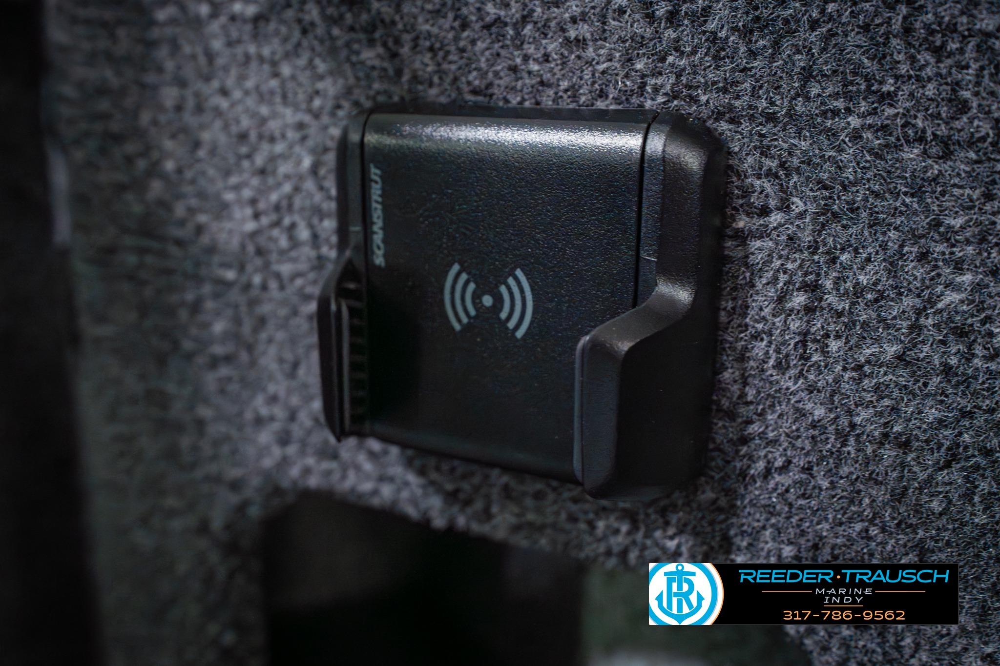 Wireless charging pad in 2026 Lund 1875 Impact XS boat interior.