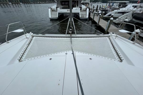 2014 Leopard 44 catamaran docked, featuring spacious deck and netting.