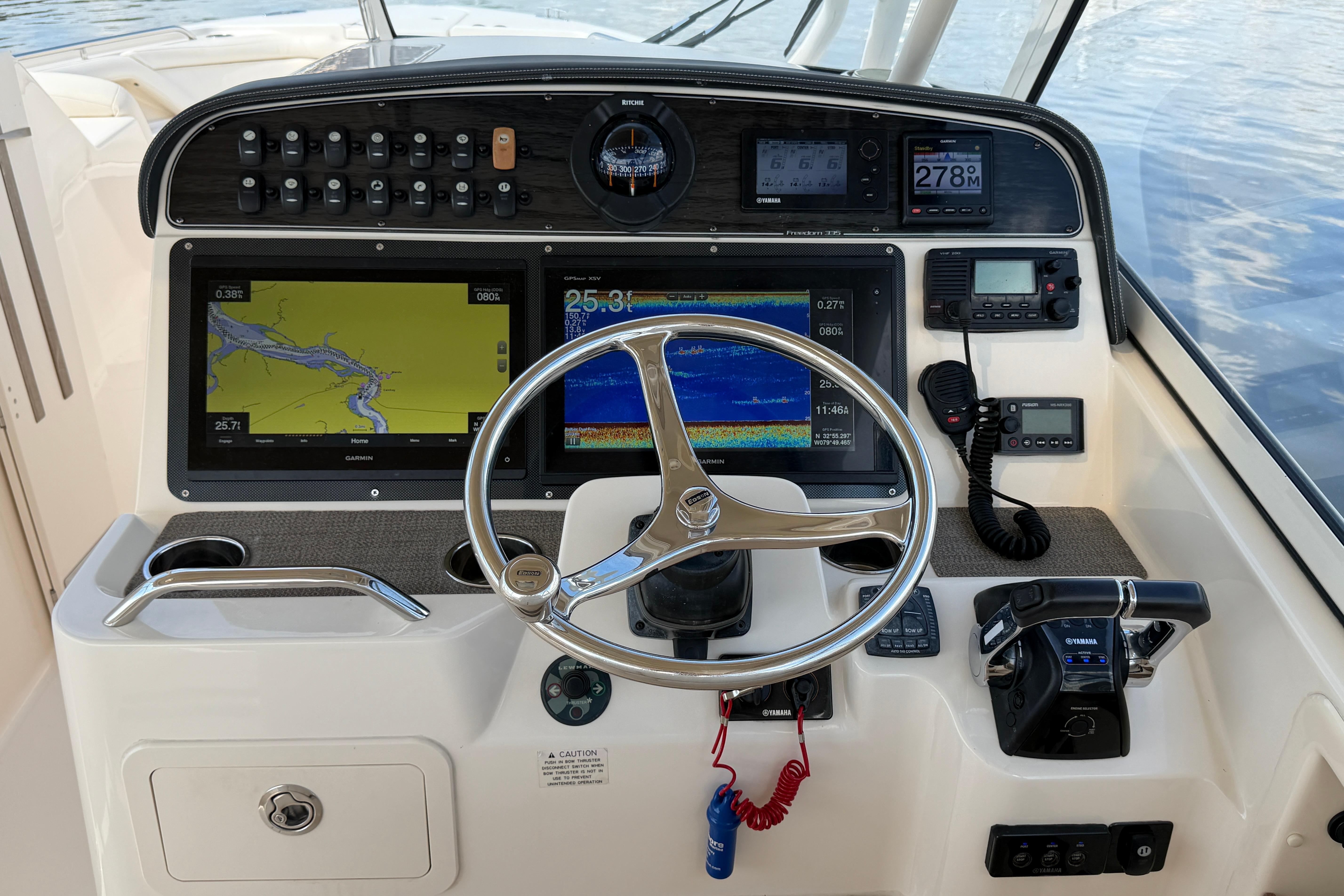 2017 Grady-White Freedom 335 helm with navigation screens and controls.