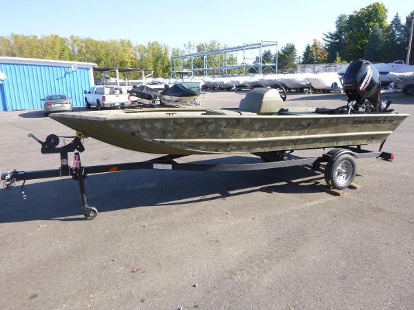 2024 Tracker Grizzly 1648 SC boat on trailer in outdoor lot.