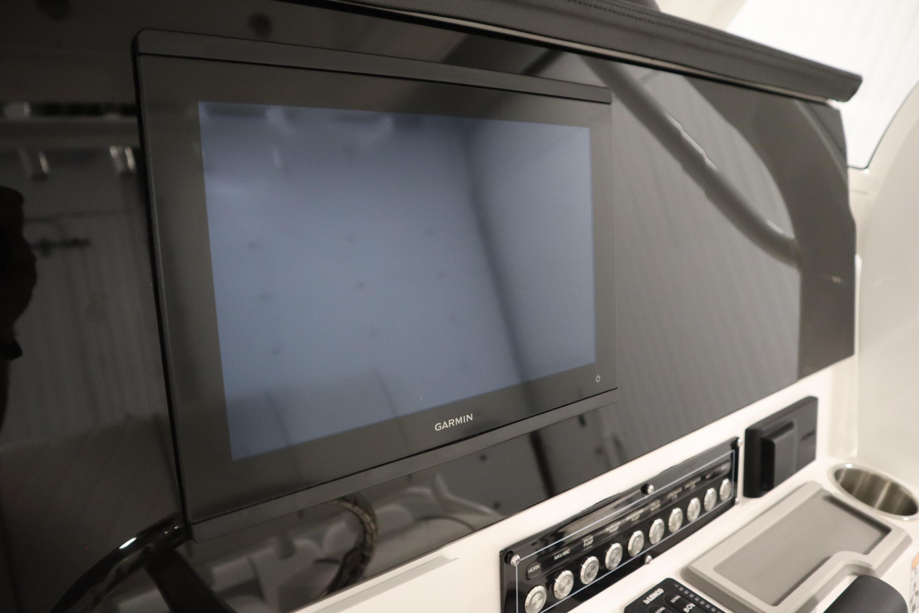 2026 Sea Fox 228 Commander dashboard with Garmin display and control panel.