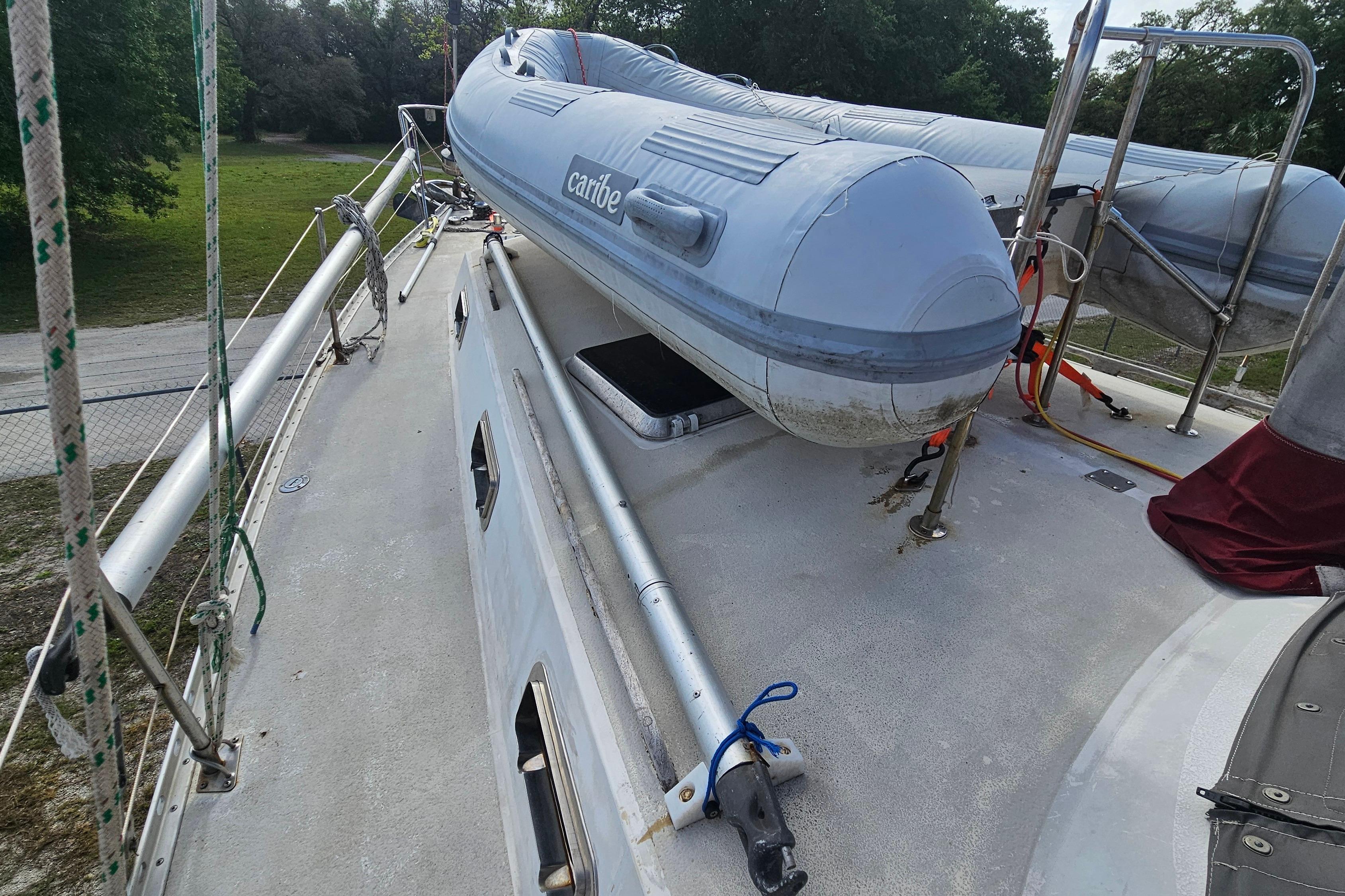Deck of 1982 Morgan 462 sailboat with inflatable dinghy and rigging.
