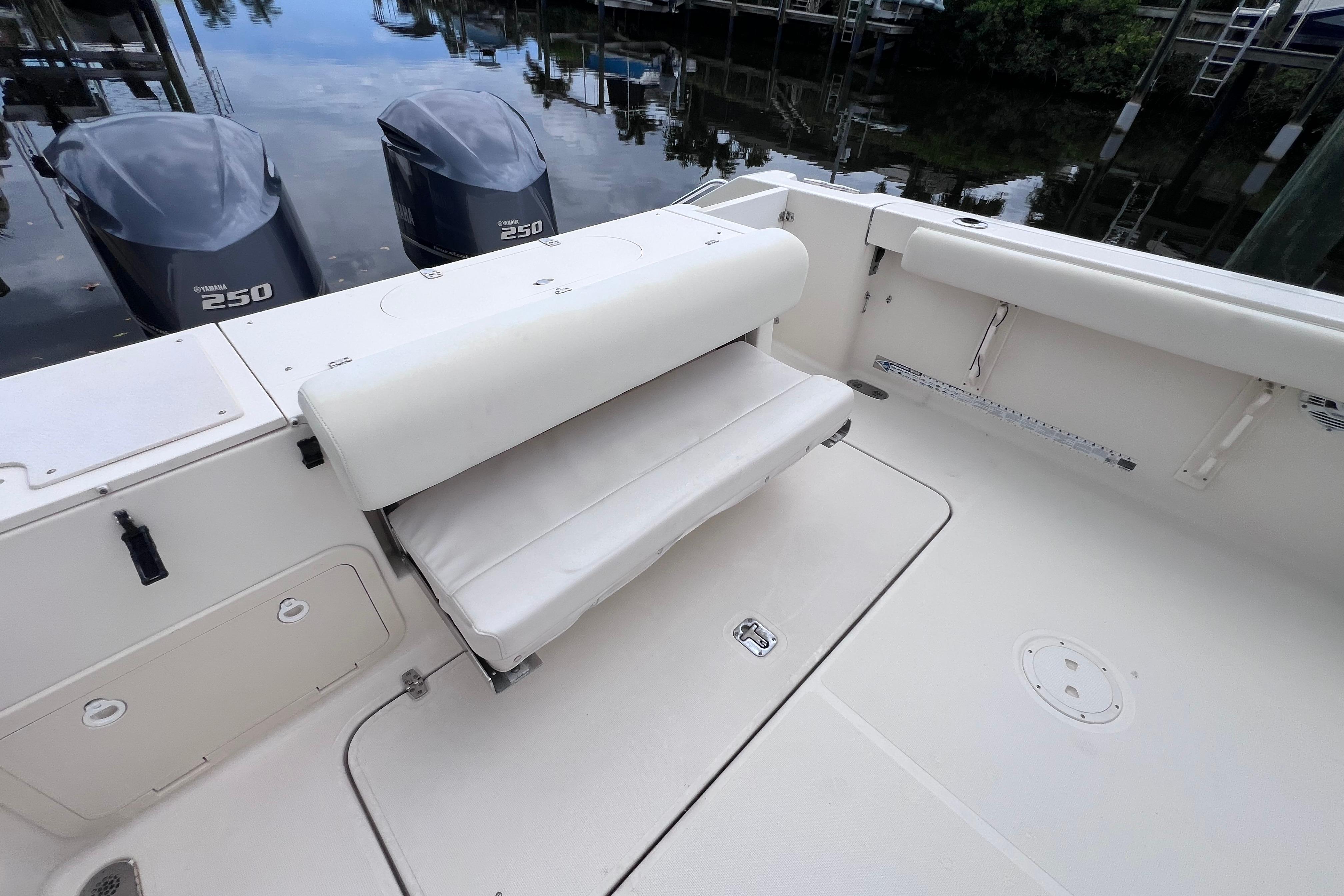 2005 Pursuit 3070 Offshore boat with Yamaha 250 engines, featuring a foldable seat.
