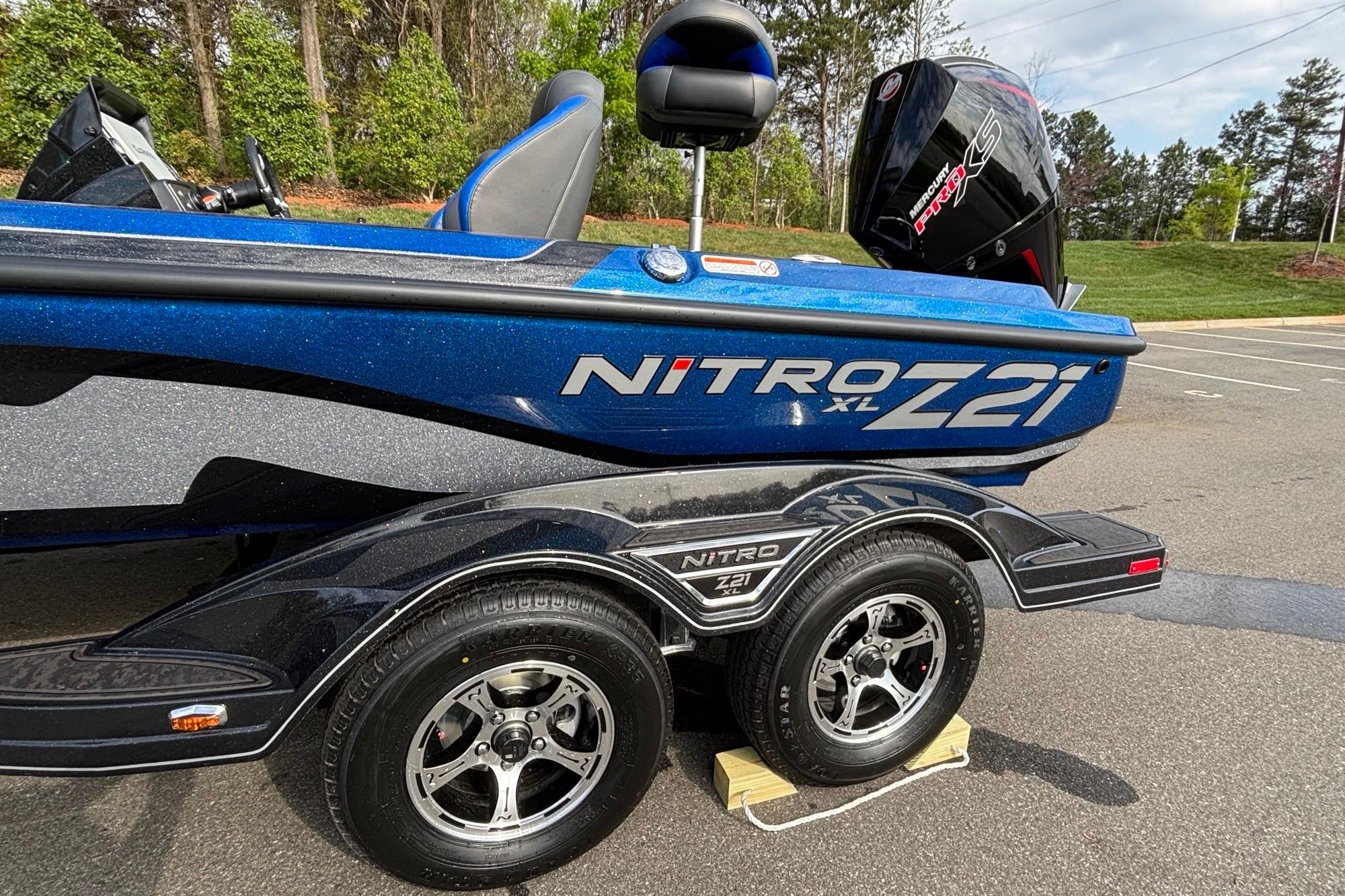2026 Nitro Z21 XL Pro boat on trailer, featuring sleek blue design and powerful engine.
