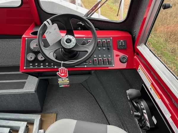 2024 Spartan 220 Maximus dashboard with steering wheel and control panel.