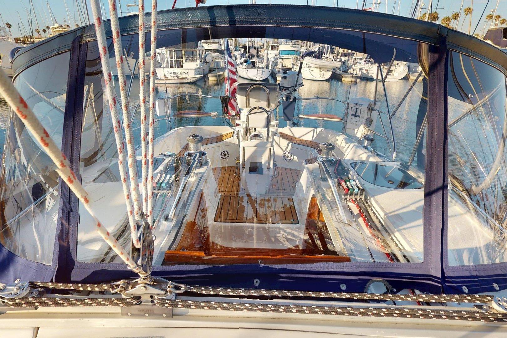Cockpit view of a 1997 Hunter Legend 40.5 sailboat docked in a marina.