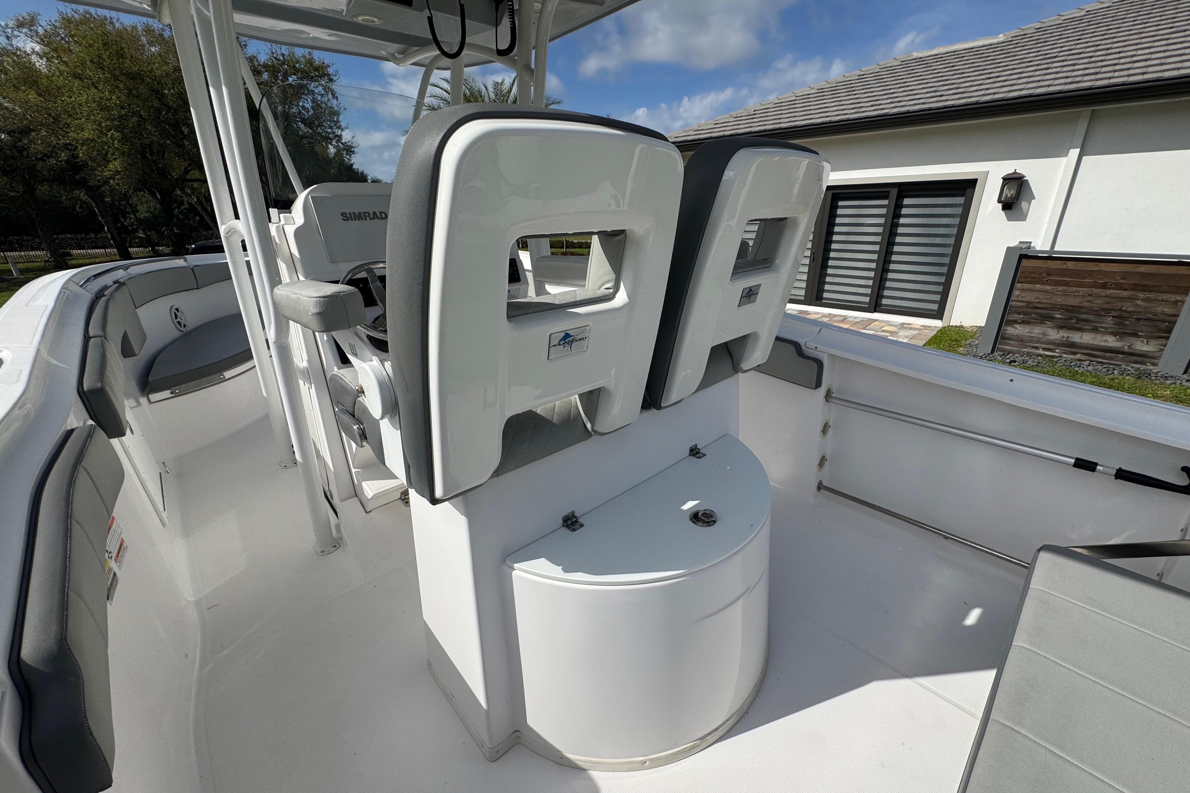 2022 Aquasport 2500 Center Console boat interior with seating and console features.