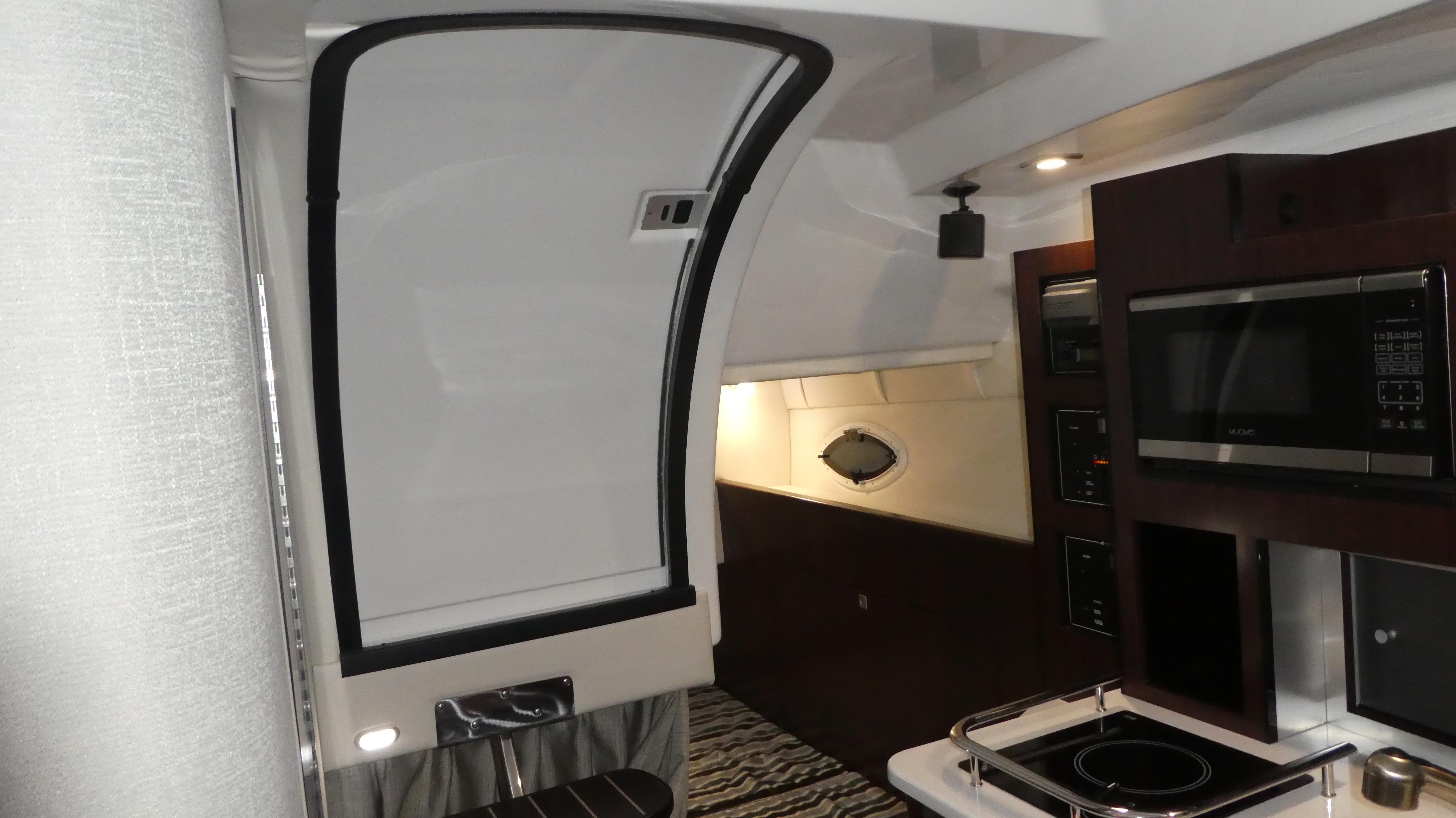 Interior of 2019 Monterey 295 Sport Yacht featuring modern kitchen.