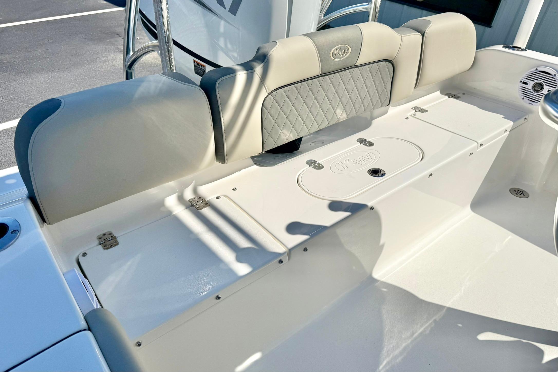 2026 Key West 189 FS boat interior with cushioned seating and storage compartments.