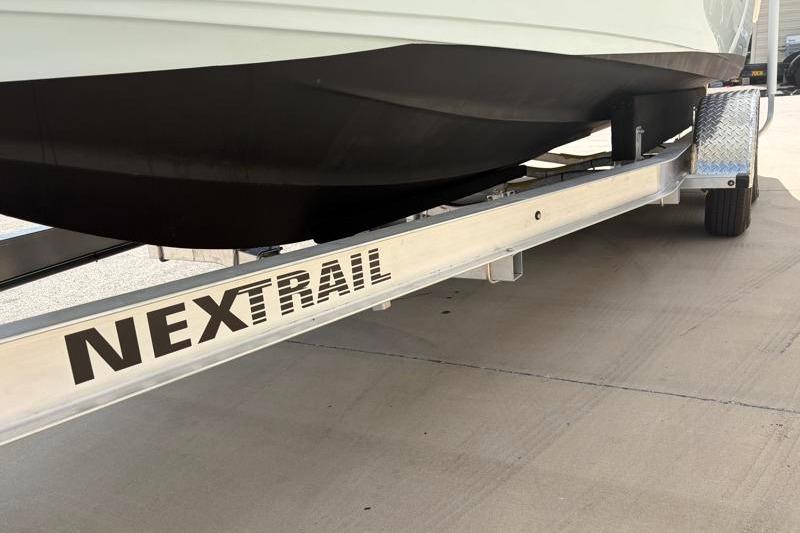 2024 Key West 239 FS boat on NexTrail trailer, close-up view.